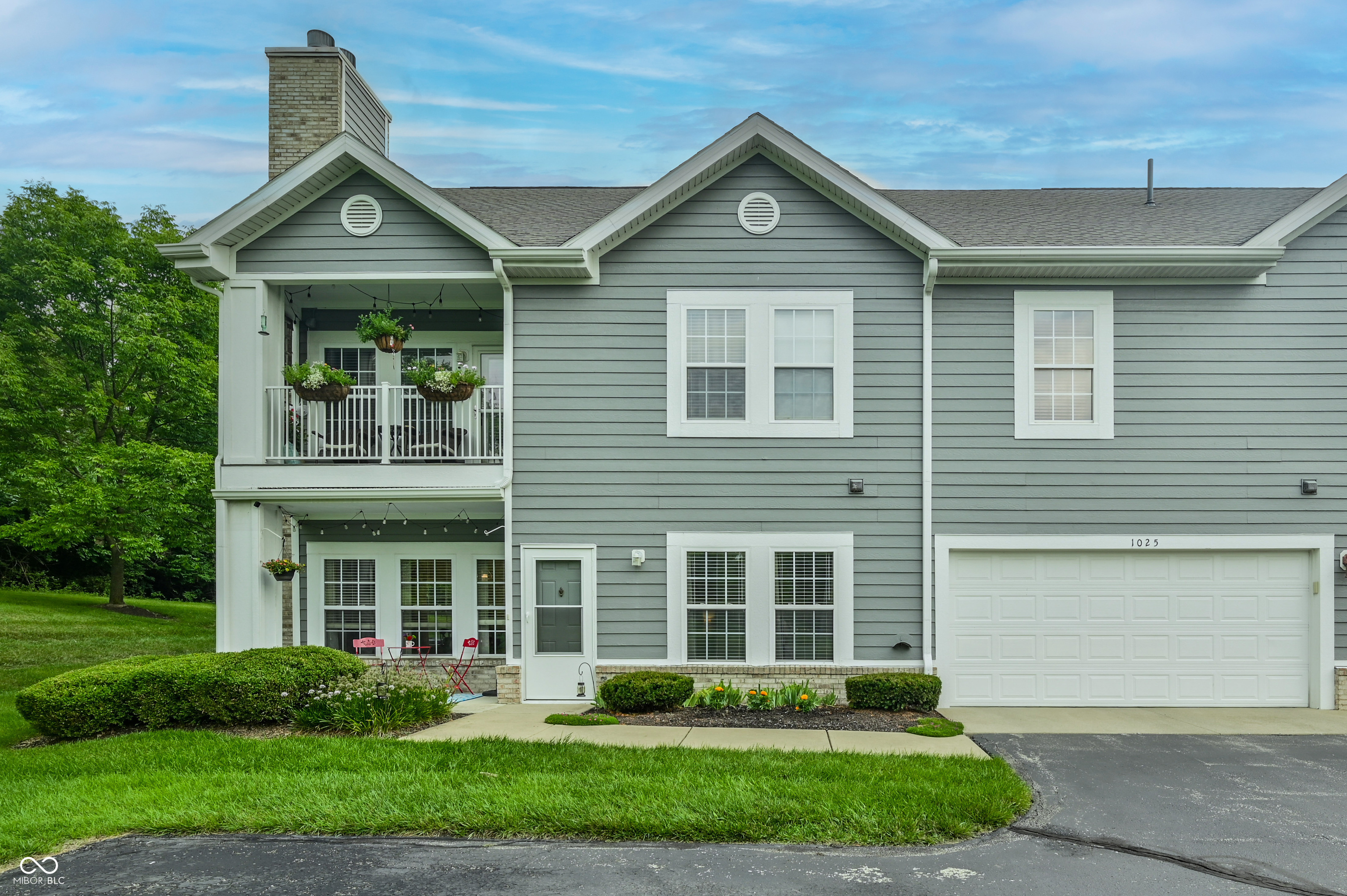 Move-in-ready main-level condo in a fantastic Carmel location with a peaceful, private-feeling setting overlooking a huge grassy field and direct access to the Monon Trail. This beautifully maintained, exceptionally clean home is warm and welcoming with an open, easy-flowing layout. LVP flooring flows throughout, complemented by all-new interior paint and an impressive list of 2025 updates, including a new HVAC, water heater, and water softener. The spacious kitchen features granite countertops, tile backsplash, stainless steel appliances, and tons of cabinet space. The airy living room is the perfect spot to relax by the cozy gas fireplace. An oversized primary bedroom offers a large walk-in closet and updated bath with double sinks and an extra-large walk-in shower. The second bedroom also features a generous walk-in closet. The laundry room has ample shelving, a built-in cabinet and includes the washer and dryer. An oversized two-car garage provides abundant storage space, built-in shelving, and a new garage door opener. Enjoy maintenance-free living with an incredible array of community amenities, including a beautiful pool with grill area, grassy game space with cornhole, scenic lake and fountain, tennis court with lines and nets for two pickleball courts, basketball hoop, business center, sauna, fitness room, and approximately one mile of walking trails. HOA includes mowing, edging, garden bed maintenance, snow removal, and more. All this in the highly desirable Carmel Clay Schools district, close to shopping, dining, parks, and everything Carmel and Indianapolis have to offer!