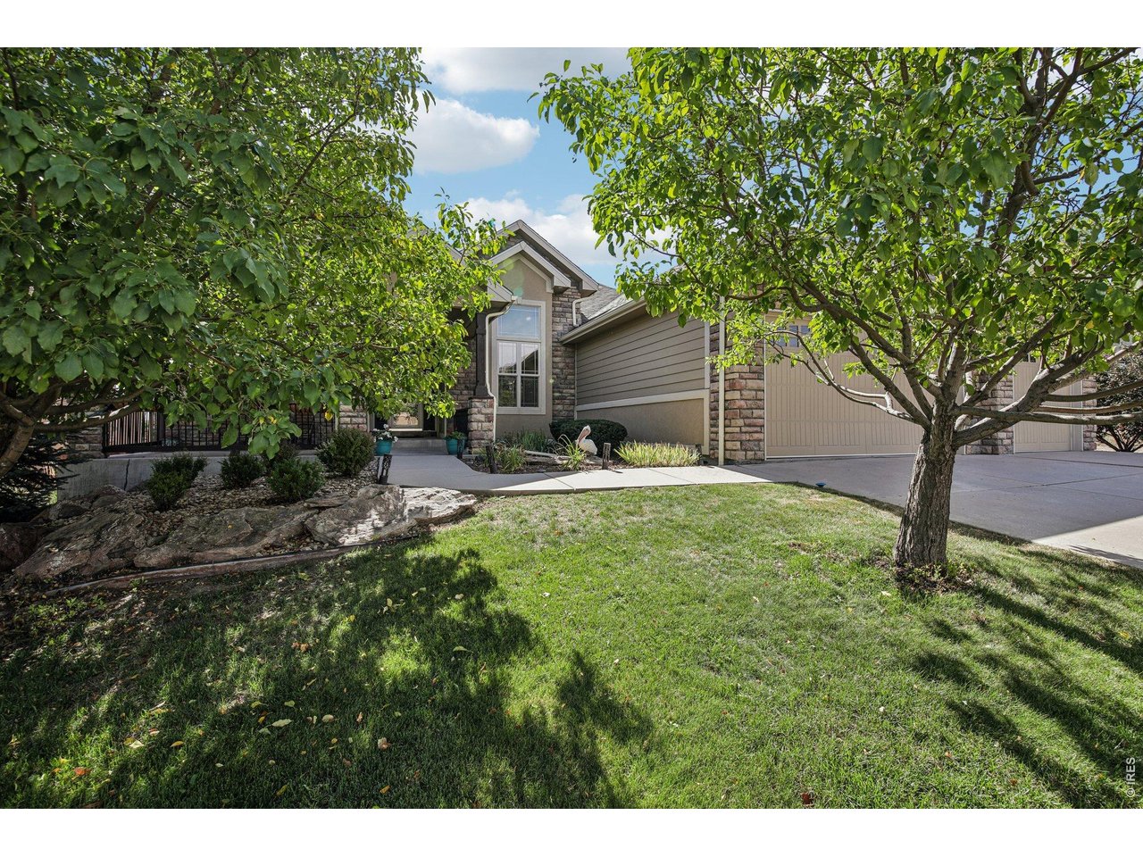 Showings start Monday 10/5. Welcome home to this custom-finished ranch in the heart of Water Valley, where main-floor living meets true "wow" factor. With only one neighbor, this 4-bedroom, 3-bathroom beauty offers the privacy and space today's buyers are searching for, all wrapped in high-end custom finishes throughout. The main floor primary suite is a true retreat, complete with a spa-inspired 5-piece bathroom. The living room impresses with a stunning stone, two-sided fireplace, warming both the living space and adjacent areas with effortless ambiance. Downstairs, the fully finished basement is made for entertaining: a stylish wet bar, spacious living room, and a versatile rec room tucked behind a custom barn door for the perfect blend of open flow and defined space. Step outside to your private backyard oasis, two expansive patio areas frame a peaceful yard, anchored by a built-in BBQ made for weekend gatherings and warm Colorado evenings. Add in a 3-car garage for all the storage and toys, and this Water Valley gem checks every box. Come enjoy all that Water Valley has to offer with beautiful walking trails along the bluffs, serene lakes, and golf course living. Homes like this , with this level of craftsmanship, don't last. Schedule your showing today!