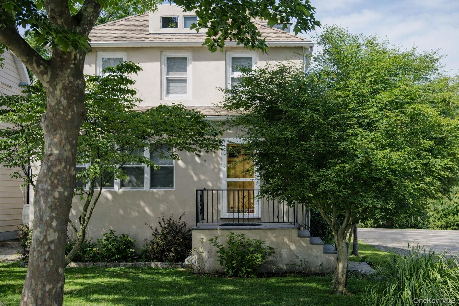 Set on a quiet neighborhood street in the heart of Port Chester, this immaculate, mint-condition home offers comfort, character, and convenience all in one. A gracious foyer sets the tone, leading into beautifully maintained living spaces highlighted by gleaming hardwood floors throughout.An enclosed porch provides a versatile sitting room—ideal for morning coffee, reading, or a home office—while the inviting living room features a classic fireplace that anchors the space. The spacious formal dining room is perfect for entertaining, whether hosting holidays or casual dinners.The kitchen is thoughtfully designed with Corian countertops, a breakfast bar/island, and plenty of workspace for cooking and gathering. The bathroom feels like a private retreat, featuring a Jacuzzi tub plus a separate stand-up shower.Outside, enjoy a private yard with room to relax or entertain, complemented by an oversized driveway offering ample parking. A detached garage and additional shed provide excellent storage options.Ideally located with strong walkability to local shops, restaurants, and everyday amenities, and just minutes from the train for an easy commute. This is a move-in-ready home that has been meticulously cared for and is ready to be enjoyed from day one.