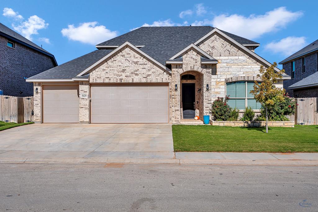 Exquisite home featuring a classic brick & stone exterior & spacious three-car garage that is sure to impress. With four bedrooms & three bathrooms, it also includes a game room for contemporary living. The open-concept layout  main floor flows into a kitchen equipped with shaker-style cabinets, under-cabinet lighting, stainless steel appliances, stylish tile backsplash, & quartz countertops. The design includes three bedrooms & two bathrooms on the main level, while upstairs boasts bedroom, bathroom, & large living area.Custom touches throughout include a makeup counter & a coffee bar.