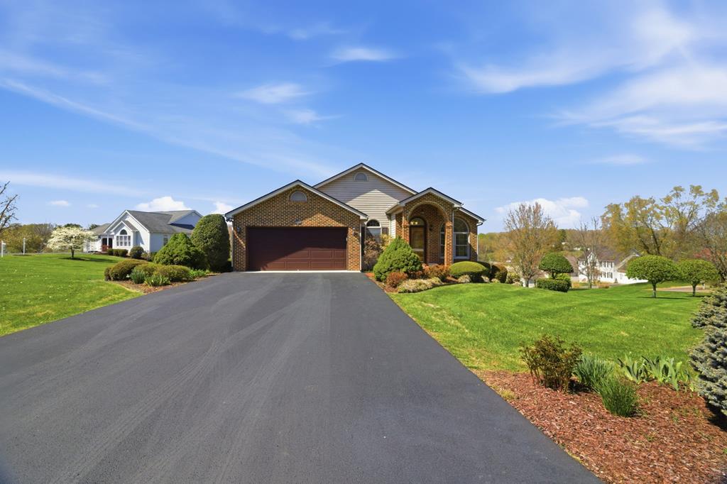 Enjoy the ease of one level living in this bright and thoughtfully designed home featuring an open floor plan with both formal and casual living spaces. The well appointed kitchen serves as the heart of the home, offering a seamless flow ideal for everyday living and entertaining.  All bedrooms are generously sized, with the great room positioned between two guest bedrooms on one side and a spacious primary suite on the other. A screened porch just off the great room provides a relaxing space to take in views of the rolling landscape and distant mountains.  A large laundry room is conveniently located just off the garage. Washer and dryer convey, including a 2025 washer dryer combo with 5 year protection plan.  Numerous recent updates add value and peace of mind, including new water heater, water softening system, whole house humidification system, garage door opener, refrigerator, and front glass and screen door. Additional improvements include two Google smart thermostats, LED lighting upgrades throughout, refinished wood front door, and two comfort fans for the upstairs deck. Driveway was sealed in 2025.  The lower level offers exceptional flexibility with its own separate entrance, two walk out doors, and access to a covered patio. Features include a full bath, gas fireplace, wet bar, flex room with closet, and a large open living area. Ideal for a mother in law suite, guest quarters, or independent living space for adult children.  This home offers space, versatility, and numerous updates. Schedule your private showing today.  Information deemed reliable but not guaranteed. Subject to E and O. Buyer and or buyer agent to verify all information.