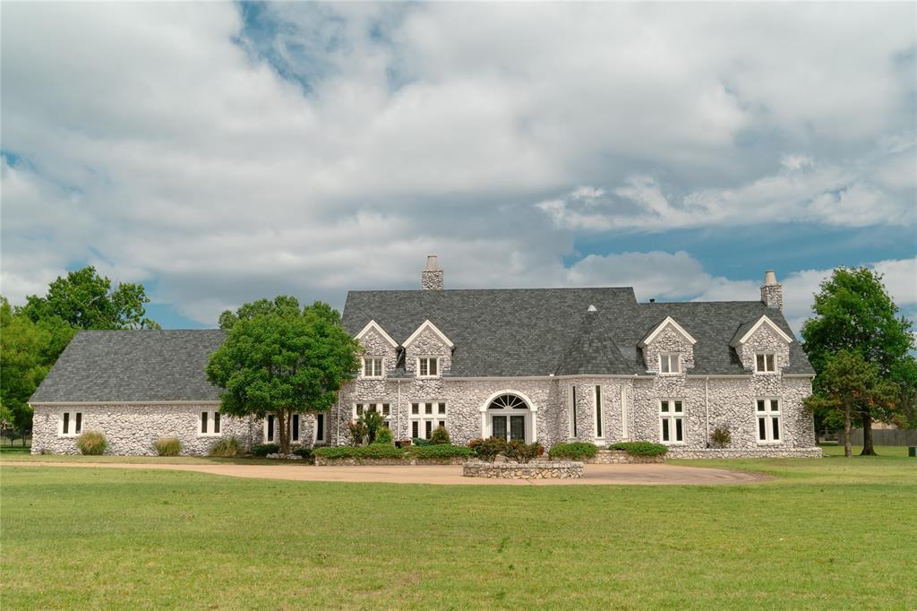 Rare opportunity to own a home in the elite Grandview Estates addition, offering the perfect blend of acreage living and everyday convenience. Situated on a beautifully maintained 2-acre lot, this property features a circle drive, additional parking, a sparkling inground pool with hot tub, and a large covered patio ideal for entertaining or relaxing outdoors.A grand entrance welcomes you with a beautifully crafted staircase and showcases the exceptional craftsmanship throughout the home.  Inside, you'll find five spacious bedrooms, five full baths plus 1 1/2 bath, three living areas designed for both comfort and functionality. The home also features a large formal dining room with built-in cabinetry, a warm and inviting kitchen with fireplace and breakfast area, a generous walk-in pantry, and countless touches throughout. This is a truly exceptional property offering luxury, space and timeless elegance.