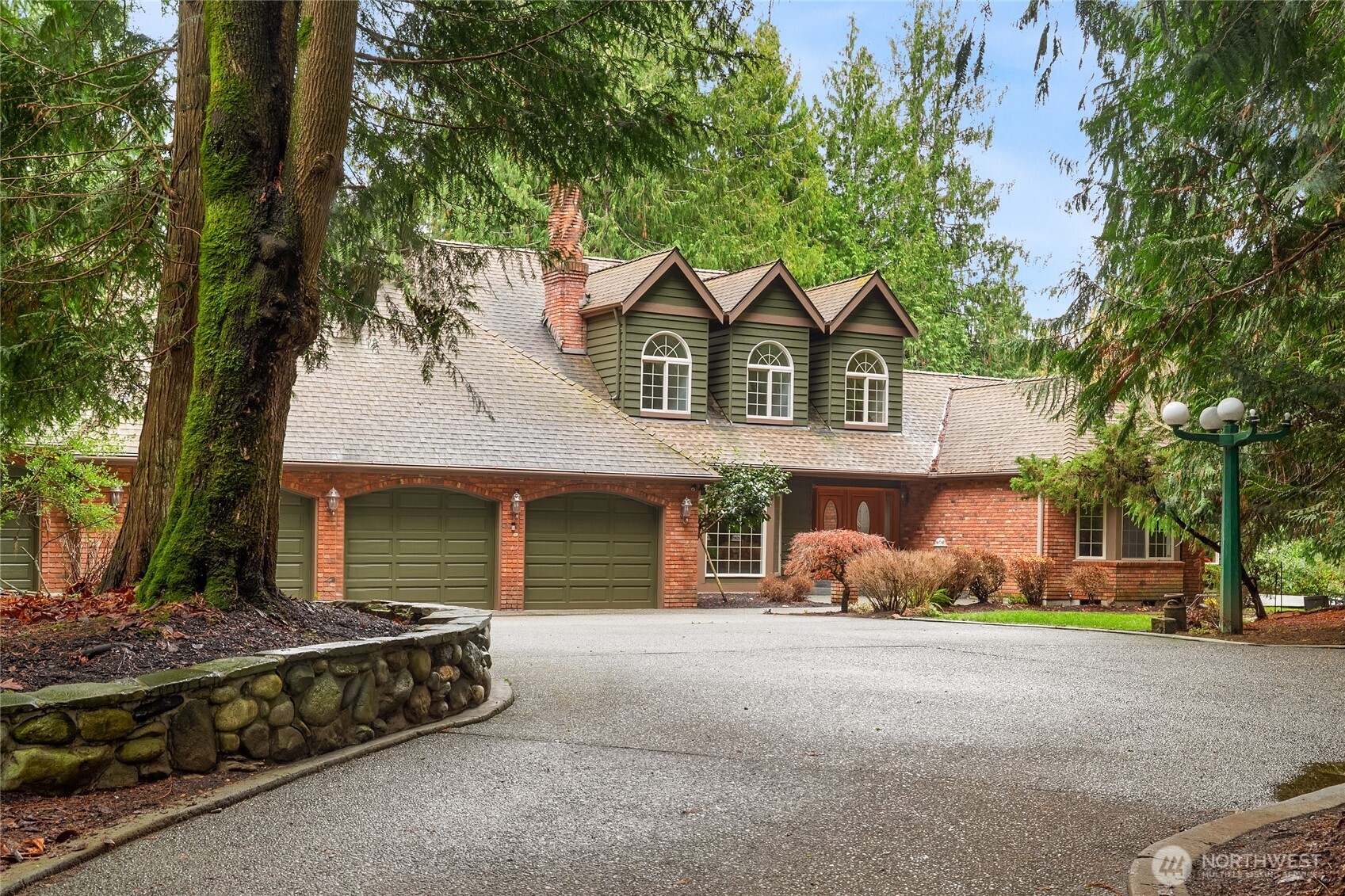 Built by a master mason and artisan, this rare all-brick 3,601 sq. ft. estate on 5 private acres features a double-gated entry, pool, over 7,500 sq. ft. of covered area including multiple "working" shops with car/truck/RV parking for 15 and horse barn with pasture.   A whimsical, well appointed guest "Treehouse" cottage includes a .75 bath, loft bedroom and living area. Thoughtful details around every corner, from the "twisted" brick chimneys to the stone accents and details throughout the entire property.  Timeless construction meets exceptional amenities, including community access to the Stillaguamish River for swimming and fishing. A serene, park-like retreat offering space, privacy, unforgettable character and unmatched amenities.