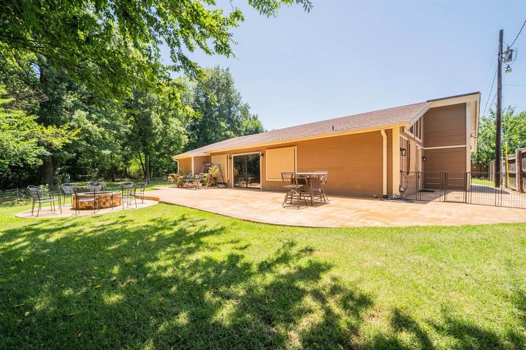 Looking for a place that's easy to love? Step into this unique and private, gated property that has everything you need! It features 1bed-1bath and a large open living area that's perfect for relaxing or spending time with family and friends. Inside, you'll find high vaulted ceilings, plenty of natural light, and recessed lights. The large u-shaped kitchen includes granite countertops, spacious breakfast bar seating, and stainless steel appliances. Enjoy wooded backyard views from the living room with a wall of windows. The 23x13 bedroom gives you plenty of room, plus an elegant bathroom with double sinks, two built-in linen closets, and an oversized walk-in shower with built-in seats. The 3-car garage includes a shop area that could easily be turned back into a second bedroom, giving you extra space for guest, home office, or hobbies. Outside, enjoy the big shady yard and huge concrete patio with a fire pit-a great spot for cookouts, entertaining, or just unwinding at the end of the day. Property backs up to a wooded area connected to Lake Coleman Park.The house is perfect for someone just starting out or looking to downsize without giving up outdoor space. It could also make a great short-term rental, thanks to its location just minutes from downtown Sulphur Springs, where you'll find shopping, restaurants, and all the fun community events.