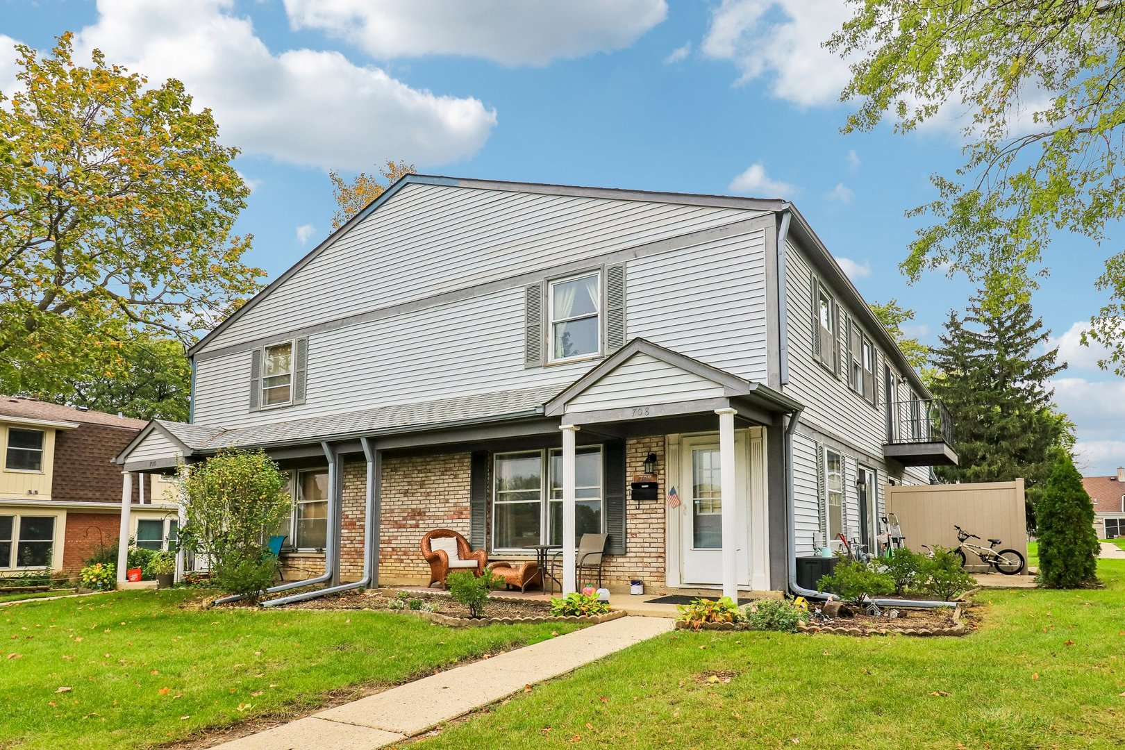| END UNIT | GREAT LOCATION | MAINTENANCE-FREE LIVING |    Parks, lakes, nature preserves, and golf are all close by to this two-bedroom, 1.5-bath end-unit townhome set among mature trees and open green space. A brick-front porch leads into a bright living room with plenty of space to spread out.  The kitchen features a pantry closet, white cabinetry, and a peninsula, flowing into a dining room with glass sliders to the back patio. A main-level half bath adds convenience.    Upstairs, two bedrooms include one with a walk-in closet, joined by hallway laundry and a full bath.    Kick back and relax, as exterior maintenance and snow removal are handled for you! Shopping is just south and interstate access is minutes away. Sold as-is.