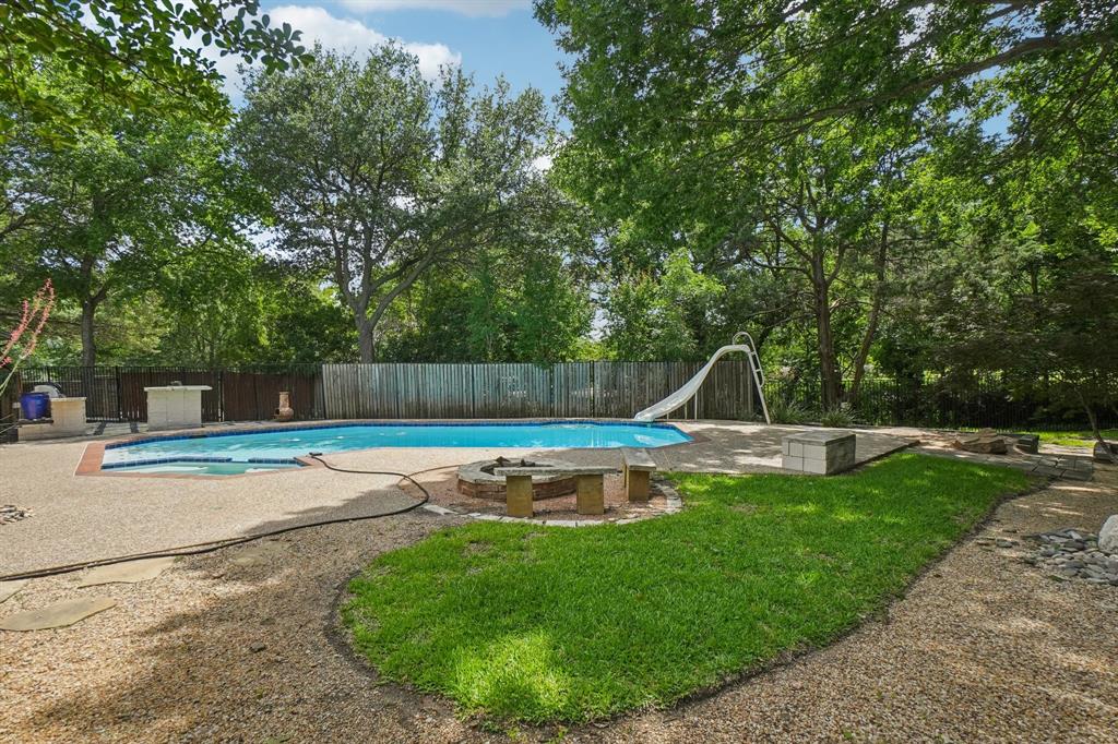 ALMOST A HALF AN ACRE BACKING UP TO A CREEK! Welcome to this beautifully designed 4-bedroom, 4-bathroom home tucked away on nearly half an acre, backing to a peaceful creek and offering a rare combination of space, privacy, and thoughtful layout. This home is ideal for multi-generational living, entertaining, or simply enjoying the serenity of nature from your own backyard. Inside, you’ll find two generously sized bedrooms downstairs, each with its own ensuite bathroom—perfect for guests, in-laws. The spacious primary suite is a true retreat, complete with not one, but two full bathrooms, offering the ultimate in comfort, and personal space. Upstairs are two additional bedrooms with a jack and jill bath. The home’s flexible floorplan blends functionality and style, with bright living areas, cozy nooks, and views that connect the indoors to the natural beauty beyond. Outside, enjoy the expansive yard, shaded by mature trees and bordered by a tranquil creek. Whether you're sipping coffee on the patio, hosting a summer BBQ, or watching the sunset, this setting offers peace and possibility.Don’t miss this unique opportunity to own a home that truly has it all—space, versatility, and a setting that feels like your own private escape.
