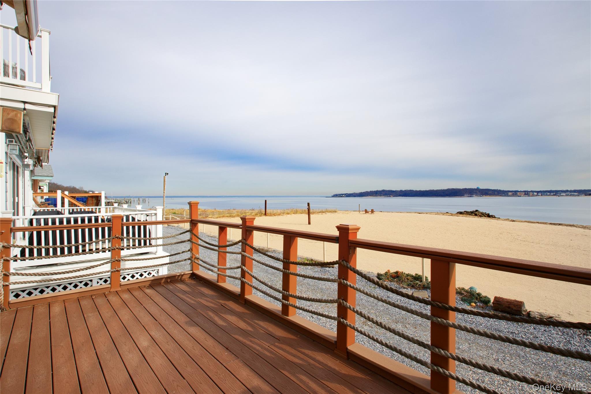 Direct waterfront living with panoramic water views from every room. Currently configured as a spacious 1-bedroom with the potential to convert to a 2-bedroom, this residence offers 3 full bathrooms and a flexible layout to suit a variety of needs. Enjoy private beach access within the community along with mooring rights, all complemented by low monthly carrying costs, delivering a true coastal lifestyle just minutes from town and LIRR.