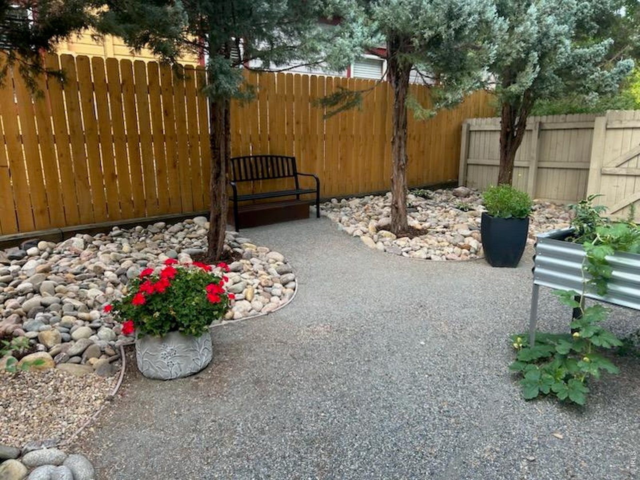 LUCKY YOU! You've found the truly most enchanting, magical home in Old Town Longmont. Fully renovated in 2011, this home maintains its quintessential cottage bungalow charm while encompassing the modern conveniences of the 21st century. Situated on a quiet, corner lot surrounded by mature pines & deciduous trees, 235 Bowen is all about indoor-outdoor living. The smart remodel provides main floor living with exposed wood ceiling beams, built-in book cases, curbless primary shower, gourmet kitchen w/ butcher block counters, main floor primary & smart laundry room hidden by clever farm door. The James Hardie siding, double pane windows & structural foundation update give you confidence in this "newer" 1910 home. The home is one and half stories, with a second floor bedroom perfect for an office or guests. Stroll out back and you'll be stunned by the professionally landscaped backyard complete with brick patio, trellis, covered walkways and heated walking paths to studio & garage. That's right, the snow melts and you don't have to shovel to get to studio or garage. The heated & air conditioned Studio could be a great office, art or yoga studio. Studio is NOT included in total square footage. You're within walking distance to Old Town's restaurants, shops, library and more. This home is all about lifestyle, LOVE WHERE YOU LIVE.