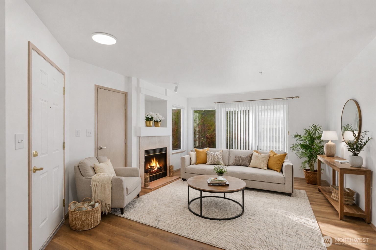 Charming first-floor condo in the gated Windsong Arbor community. Ideally located just minutes from Hwy 167 with easy access to schools, shopping, dining, and transit. This light-filled home features an open, functional floor plan, a private patio, and an updated kitchen with built-in water filtration system at the sink. Recent upgrades include fresh interior paint, brand-new laminate flooring throughout the main living areas, and new carpet in both generously sized bedrooms. The primary suite offers an ensuite bathroom with a walk-in shower and built-in bench. Additional features include a full-size washer and dryer, one reserved carport space, and extra storage. Enjoy secured, gated community & amenities such as a clubhouse, fitness center, gathering space, sports court, and pet-friendly areas. HOA dues include water, sewer, garbage, and gas for the fireplace.