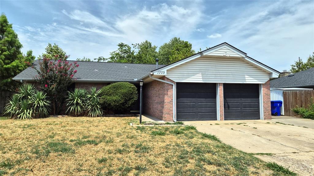 This charming Norman home is conveniently located near Eisenhower Elementary, beautiful parks, and the 12th Ave Recreation Center. With great curb appeal, an extra-wide driveway, and a wide gate for trailer or boat storage, this property offers both convenience and flexibility.The backyard is designed for outdoor enjoyment, featuring a spacious freestanding screened porch with an outdoor prep counter and sink, and two storage buildings, one with electricity. Whether you're entertaining, gardening, or simply relaxing, this outdoor space is made for your enjoyment.Inside, you'll find a comfortable layout with a spacious living room and cozy fireplace. The kitchen features modern countertops, backsplash, and stainless-steel appliances, while the laundry room includes pantry space for extra storage. The remodeled hall bath features a heated tub with jets, and the primary suite offers a private bath and large closet. Additional highlights include a two-car garage with an above-ground storm shelter.