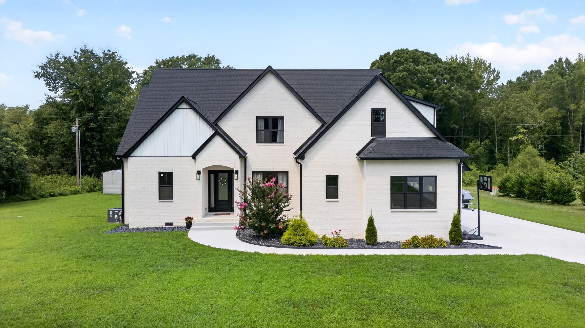 Step into luxury, comfort, and room to breathe. Nestled on over 5 beautiful acres, this stunning, like-new home offers the perfect blend of modern elegance and peaceful country living. Inside you will be captivated by the soaring ceiling, abundant of natural lighting coming through the large sliding back doors, and an open-concept design that's perfect for both everyday living and entertaining. The dream kitchen is a true showstopper featuring high-end appliances, double ovens, a gas range, gorgeous tile backsplash, premium cabinetry, and upscale finishes that make every meal a pleasure. With 4 spacious bedrooms, 3.5 bathrooms, and a large bonus room, there's plenty of space for family, guests, or a home office. Throughout you will find designed fixtures, thoughtful details, and quality craftsmanship that elevate every room. Outside, enjoy the privacy and endless possibilities that come with 5+ acres, whether dreaming of outdoor entertaining, gardening, or simply relaxing on the amazing covered patio, this home has it all. A 2 car attached garage provides convenience and additional storage. Only minutes from Devil Step public boat launch on Tims Ford Lake.