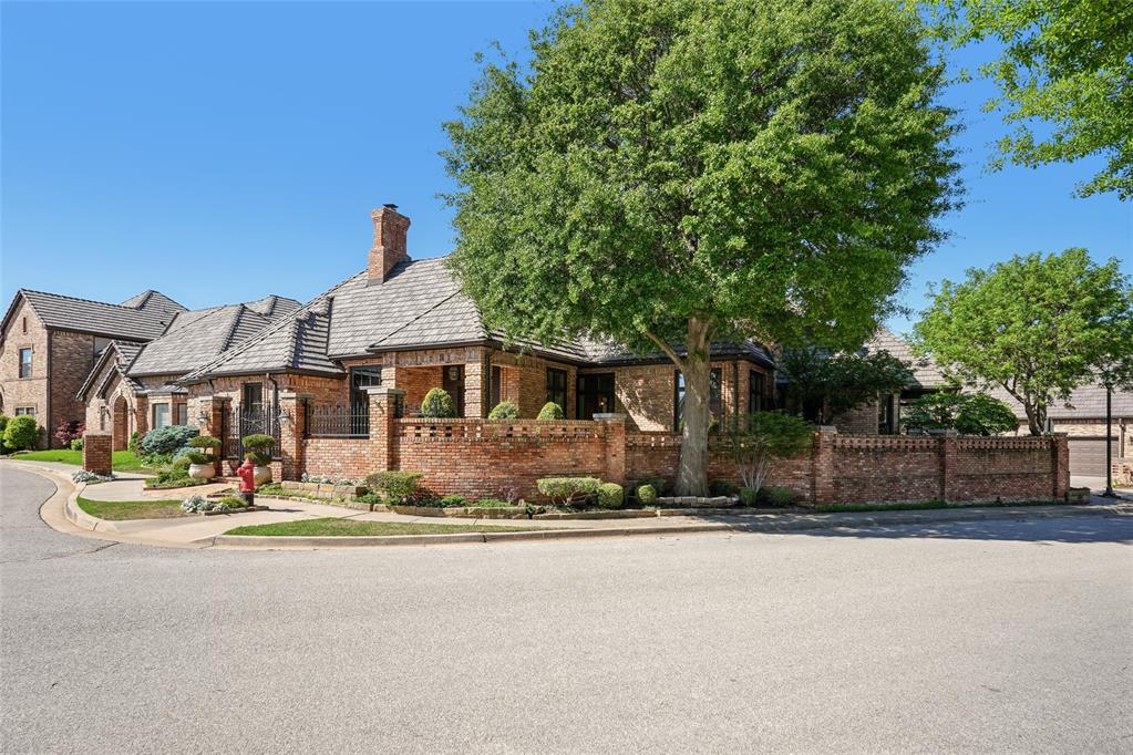 Entering the grand foyer, you are greeted by soaring ceilings and custom wood flooring with intricate 'Wange' inlays—setting a tone of elegance and craftsmanship throughout. Expansive archways lead into a refined library, richly appointedwith dark-stained Mahogany wood, creating a warm and sophisticated atmosphere. Ideal for entertaining, the formaldining and living rooms flow seamlessly into a custom bar area, all framed by expansive bay windows that offerpicturesque views of the surrounding landscape. The kitchen is a enthusiast’s dream, featuring granite countertops,generous cabinetry, and built-in display cases for china and crystal. A high-end gas cooktop, electric double ovens, and acentral island complete this well-appointed space. Adjacent to the kitchen, the Sun Room is bathed in natural light andhighlighted by a charming chandelier—perfect for formal or casual gatherings. A distinctive late 1800's hotel door with acustom wooden vanity from Austria adds a unique touch, while the utility room includes space for a small office area foradded functionality. The master suite is a private sanctuary, with French doors opening to a secluded patio. The masterbath includes a hidden vanity, a spacious garden tub, separate shower, and a private toilet area, complemented bya generous walk-in closet. Upstairs, a versatile bonus room awaits, complete with built-in wooden cabinetry, office desk,and a three-quarter bath with a walk-in shower—ideal for use as a home office, media room, or guest suite. Two additional bedrooms share a well-appointed Jack and Jill bathroom, providing both privacy and comfort for family or guests. Outdoors, the covered patio features a concealed entertainment center-offering a perfect space for alfrescorelaxation. Topping it all is a durable and elegant DaVinci roof, installed just five years ago, ensuring lasting quality and peace of mind. This home exemplifies timeless design, luxurious detail, & exceptional livability.