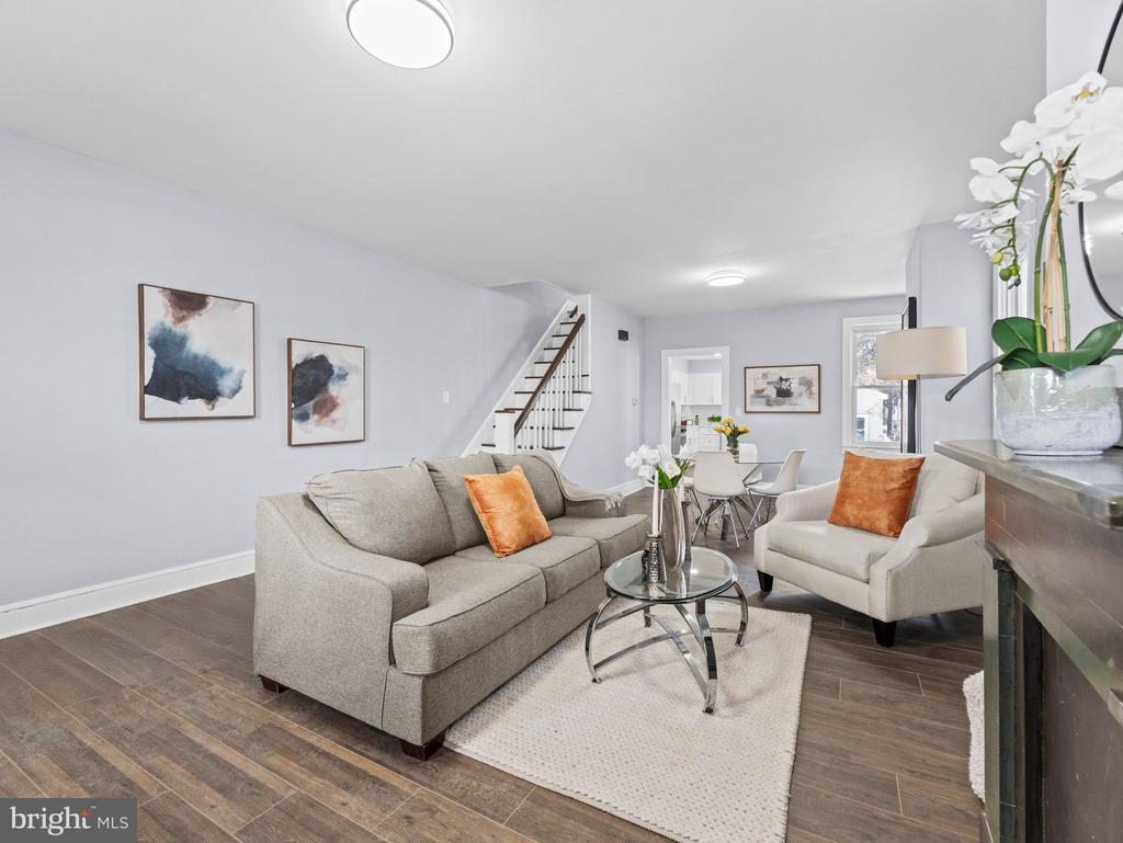 Welcome to Burlington City! This beautifully renovated interior row townhouse offers the perfect combination of space and comfort-ideal for a growing family. The spacious living room features a charming decorative fireplace and flows into the dining area and large kitchen with a full appliance package, making it perfect for everyday living and entertaining. This three-story home boasts 5 bedrooms and 2 full bathrooms, along with fresh paint and brand-new flooring throughout for a true move-in-ready experience. A detached one-car garage adds convenience, while the prime location provides easy access to major highways, shopping, and dining. Don't miss your chance to call this exceptional property home!