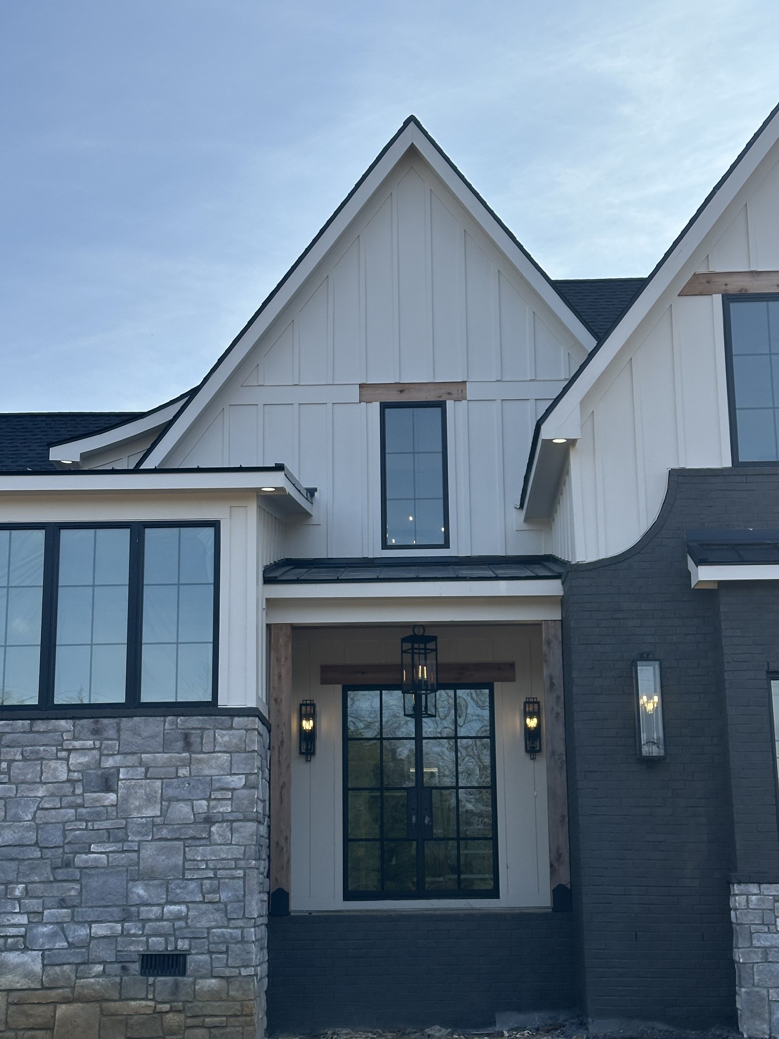 **$15k in seller paid closing costs with preferred lender.** Welcome to this beautifully crafted classic modern home, sitting on over 2 private acres, offering space, privacy, and timeless design; featuring 5 bedrooms, 4.5 baths, and a 3-car garage. The main level showcases high ceilings in the foyer, cedar beam & wood ceiling accents, a stone fireplace with custom built-ins, and a covered back patio with a wood-burning fireplace. The open kitchen includes a gas cooktop, prep pantry with second sink and fridge space, wet bar, and open shelving. An integrated indoor/outdoor home sound system enhances everyday living, with additional pre-wiring in the bonus room for surround sound. The main-level primary suite offers vaulted ceilings, a spa-style bath with soaking tub inside the shower, and a large walk-in closet with island. There's also a Guest Suite on the main level with a private bath and vaulted ceilings. Upstairs features a private office, a spacious bonus room with wet bar and three bedrooms with bath access. Buyer may select outdoor kitchen cabinet color and countertop from in-house selections once under contract. One-year builder warranty included. Completion date January 31, 2026.