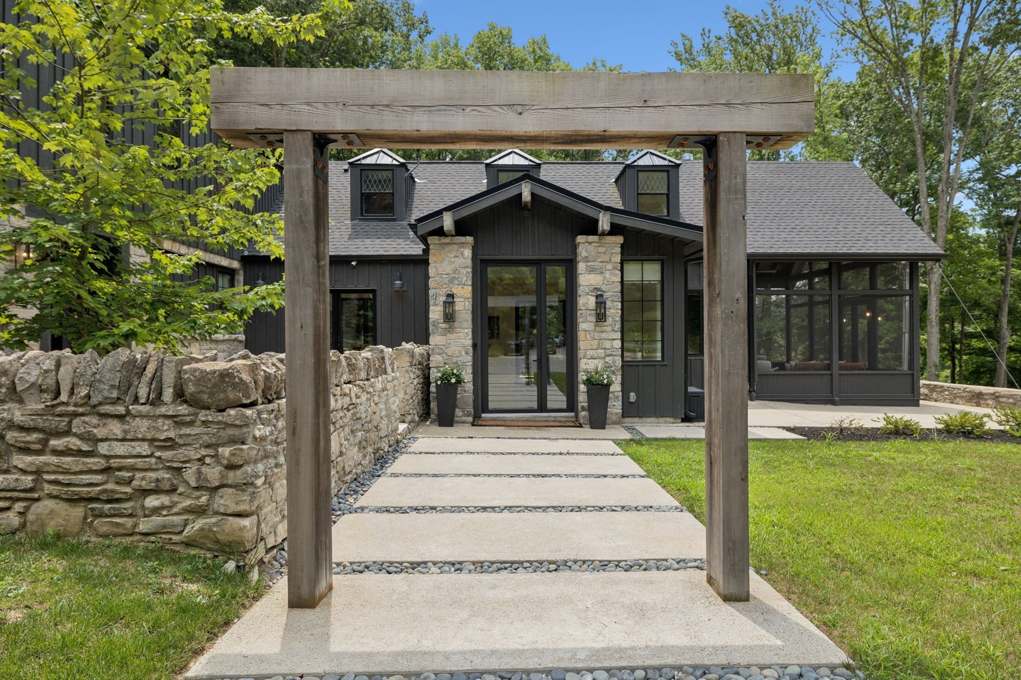 Tucked away in the heart of Leipers Fork, this extraordinary 17.27-acre estate delivers a rare blend of luxurious living, pastoral charm, and modern convenience. Every inch of this refined retreat has been thoughtfully designed to embrace both elegance and comfort. At the heart of the home, you'll find a chef-inspired kitchen outfitted with high-end, Fisher & Paykel appliances and crafted for both entertaining and everyday use. Smart home features are integrated throughout, offering convenience at your fingertips, while a whole-house water filtration system ensures pure comfort in every drop. Step into the primary suite and experience true indulgence—complete with heated floors in the spa-like bathroom, designed for unwinding in style. Outdoors, the lifestyle continues: soak in the private spa oasis featuring a sauna, cold plunge, and open-air shower, or relax poolside with room to entertain beneath the wide Tennessee sky. A 3-car garage provides generous parking and storage, with an expansive 1,500 sq ft flex space above—perfect for a private office, creative studio, or future guest suite. The property also features a charming four-stall barn with a tack room, ideal for equestrian pursuits or hobby farming. With room to expand and the possibility of additional bedroom configurations, this estate adapts to your evolving needs. Located just minutes from Historic Downtown Leipers Fork, WestHaven Golf Club, and the vibrant streets of Downtown Franklin, the home offers peaceful seclusion without sacrificing access to the area's most sought-after destinations. The land benefits from Greenbelt Forestry status, providing potential tax advantages for the next owner. For those seeking a fully furnished turnkey opportunity, the entire collection of furnishings is available for purchase. Experience the perfect balance of serene country living and elevated modern luxury—this is a once-in-a-lifetime opportunity to call Leipers Fork home.