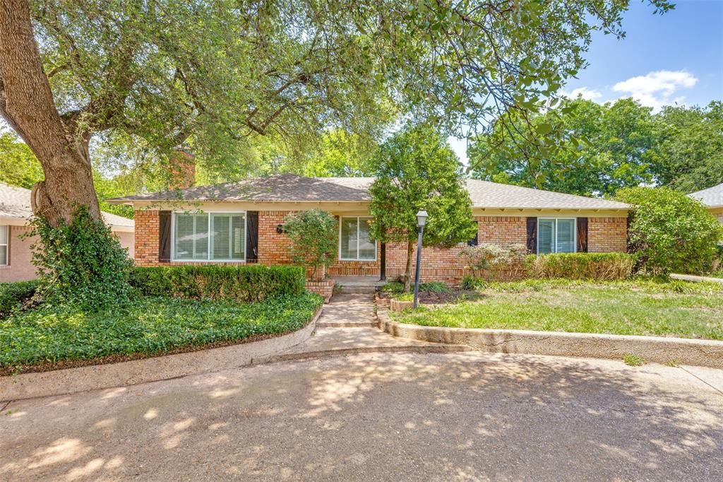 Freshly painted living dining rooms to create a light and bright look. Large stone fireplace in living room. This Preston Hollow home has hardwoods through out, Plantation Shutters, and a kitchen full of amenities with space for a small breakfast table. Wood deck looks out to a large back yard and trees. Wood and brick fence. Easy in and out access with a circle drive. Two Car detached garage. 
This property is also available for lease.