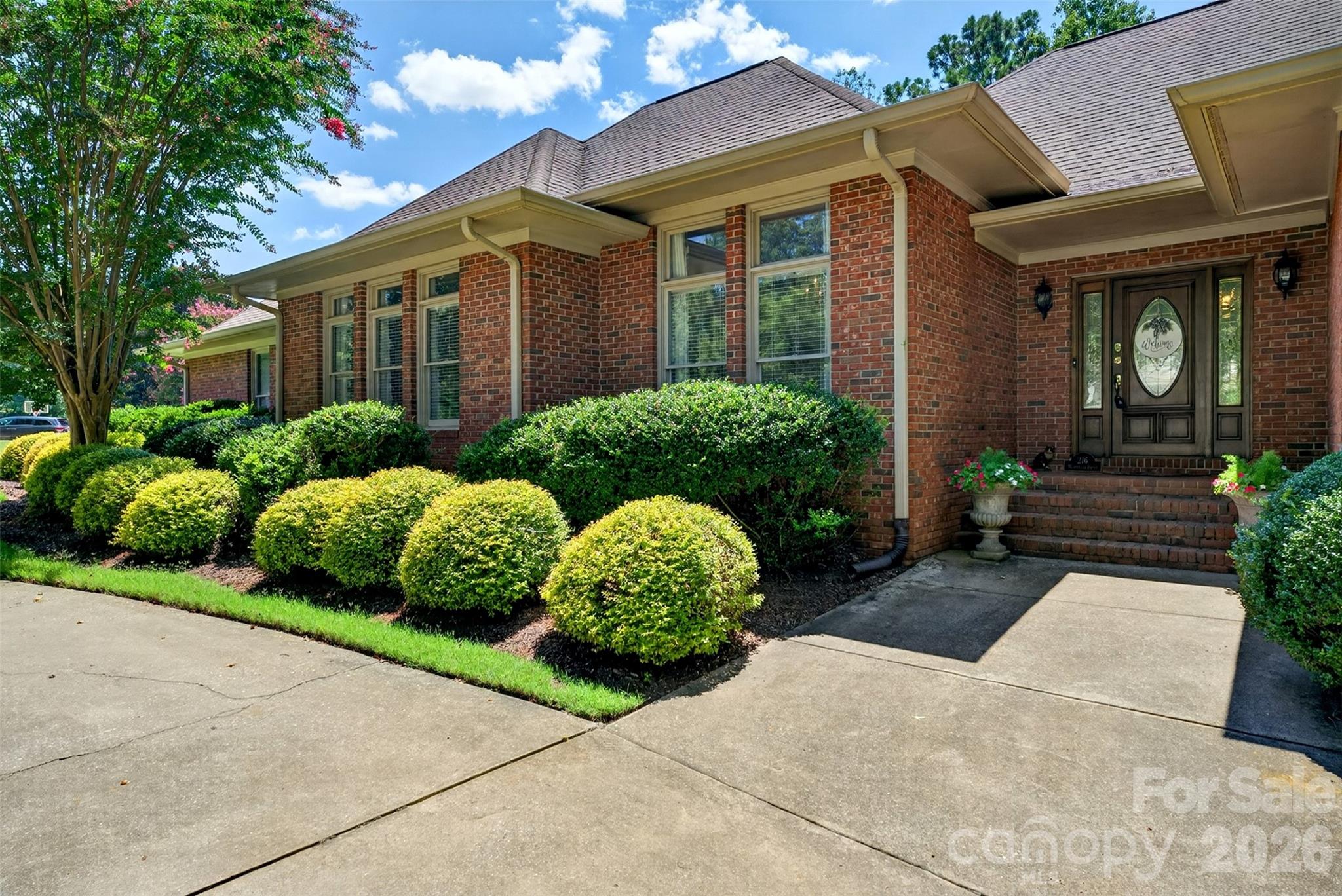 There comes a season in life when home becomes less about maintaining it and more about truly living in it. A place where mornings begin with coffee in a beautifully renovated kitchen, afternoons are spent with friends on the golf course or enjoying lunch at the club, and evenings end surrounded by comfort, peace, and the people who matter most.Welcome to 216 Muirfield Drive, where every detail has been reimagined to create a home that feels as effortless as it is beautiful. Nestled within the prestigious gated community of Carolina Country Club, this exceptional one-level residence offers the rare luxury of step-free living, allowing you to move throughout your home with ease today and for years to come.The heart of the home is a completely remodeled designer kitchen, featuring stunning custom cabinetry, premium countertops, luxury Thermador appliances, updated fixtures, and inviting spaces where holiday meals, quiet breakfasts, and conversations long after dinner naturally unfold. Every bathroom has been beautifully renovated, while new flooring, fresh paint, and carefully selected finishes throughout create a home that feels crisp, timeless, and completely move-in ready.The thoughtfully designed floor plan provides generous living spaces and convenient bathroom accessibility without a single interior or exterior step to interrupt everyday living. Whether you're welcoming family, hosting lifelong friends, or simply enjoying the quiet rhythm of home, every room has been designed for comfort without compromise.Beyond your front door, a lifestyle awaits. Optional membership at Carolina Country Club opens the door to championship golf, tennis, swimming, fitness, exceptional dining, and a vibrant social community where neighbors quickly become friends and every season brings new opportunities to gather and celebrate.Some homes simply check boxes. Others quietly capture your heart. 216 Muirfield Drive is the kind of home where life's next chapter feels a little simpler, a little more beautiful, and exactly where you're meant to be.
