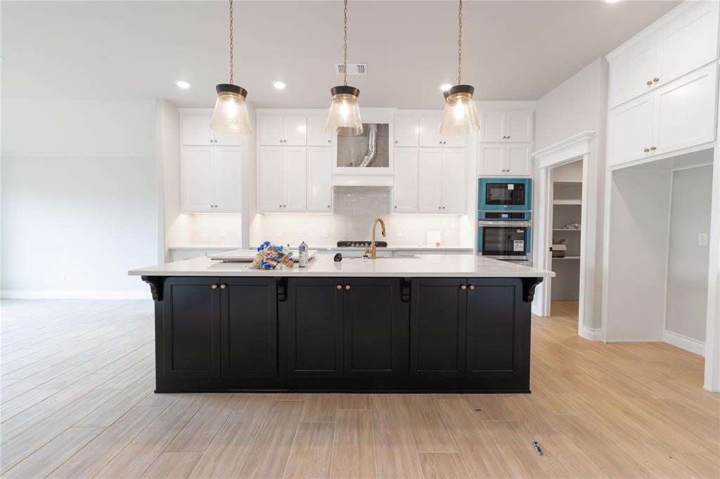 This Korbyn floor plan includes 3,895 Sq Ft of total living space, which includes 3,625 Sq Ft of indoor living space and 270 of outdoor living space. There is also a 690 Sq Ft, three-car garage with an in-ground storm shelter installed. This truly spectacular home offers 5 sizeable bedrooms, 4 full bathrooms, a half bath, 2 covered patios, an In-Law/guest suite, a mud area, a utility room, and a generous bonus room. Pass the covered front porch and the dual height entry lies the ultimate floor plan. The great room embraces wood-look tile, a spectacular cathedral ceiling with a ceiling fan, a luxurious 3-panel sliding door with a 4' back patio extension, rocker switches throughout, and a center gas fireplace surrounded by our stacked stone detail. The great room opens to the kitchen and boasts an oversized center island with a trash can pullout installed, custom-built cabinets to the ceiling with cabinet hardware and under cabinet lighting, 3 CM countertops, a HUGE walk-in pantry, stainless steel appliances, a 5-burner cooktop, double ovens, adorning tile backsplash, stunning pendant lighting, and ample storage opportunities. The secluded primary suite features windows, our cozy carpet finish, a ceiling fan, and our sloped ceiling detail. The outstanding primary bath features a European walk-in shower, a separate sink vanity concept, a free-standing tub, a private water closet, & TWO primary walk-in closets. Bedroom #2 lies towards the front of the home and spotlights an In-Law/guest suite set up with a walk-in closet included. The second level holds the generous bonus room, a full bath, a Jack and Jill bathroom set up, and bedrooms #3, #4, and #5. Outdoor living proudly supports a corner wood-burning fireplace, a gas line for your grill, and a TV hookup. Other amenities for this stellar home include a tankless water heater, an air filtration system, a fresh air ventilation system, and so much more!