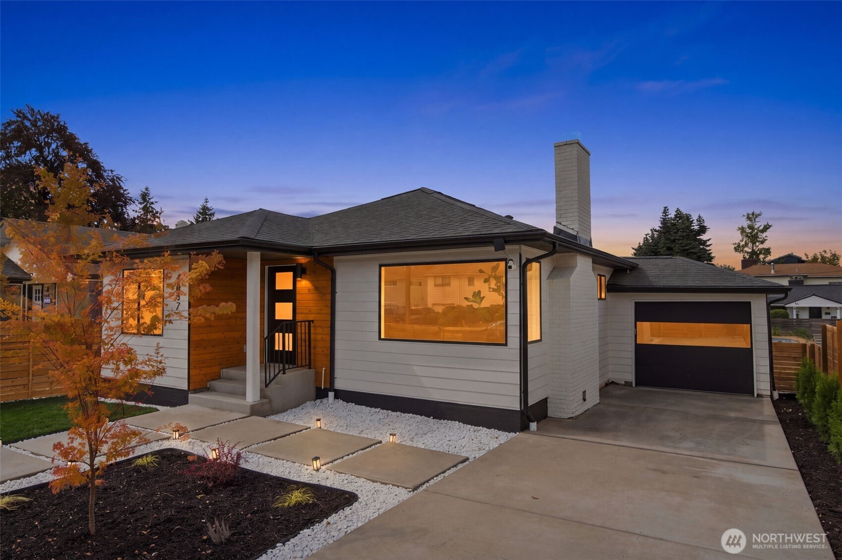 Welcome to this stunning complete rebuild in the heart of Beacon Hill. Down to the studs, every major outdated system has been redone, and redesigned. Permitted and craftsmen built, the result is a designer driven 4-bed, 1.75-bath home with 1,960 SF across two finished levels. The attention to detail shines as you walk through the main floor featuring a bright living room, dining area and chef's kitchen /w an oversized island, quartz counters, stainless appliances, custom tile backsplash and solid wood soft-close cabinetry. A large living room with electric fireplace blends seamlessly with the dining area /w a bay window. A serene upstairs bedroom with a private deck, second bedroom and custom-tiled bath with brass fixtures complete the level. Downstairs is a large primary, and one additional bedroom, a full bath, laundry and a generous flex/rec room /w wet bar, wine fridge and wood fireplace- perfect for movie nights, guests, work or game day. Nearly every major system is new, including electrical, plumbing, heat-pump, windows, doors and insulation. LVP flooring, carefully selected finishes, fresh landscaping along /w a fully rehabilitated garage /w EV parking complete the package. Pre-inspected with report, scope, feature sheet and a note from the builder Close to Maple Wood Playfield, Jefferson Park, local dining, Metro service and light rail. Easy access to Beacon Hill, Columbia City, Georgetown, SODO, downtown, I-5 and I-90. Tour soon, value like this won't last!