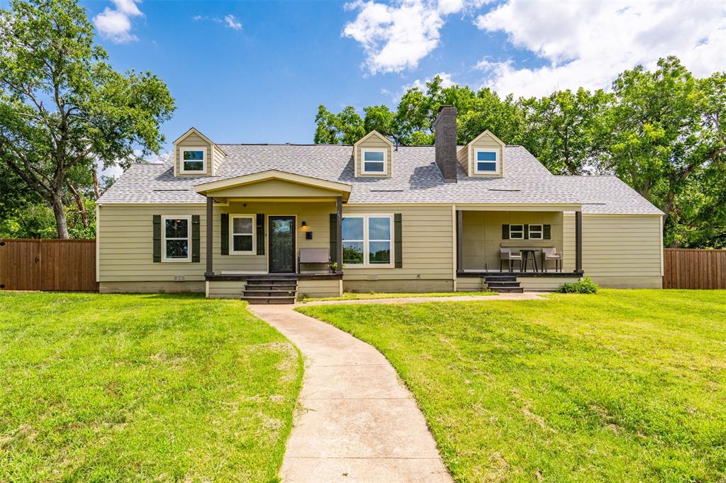 Here’s your chance to own this beautifully one of a kind property sitting on a corner lot just under half an acre, surrounded by mature trees and only a short drive to downtown Fort Worth! Renovated from top to bottom in 2022, this home offers two primary suites and a charming curb appeal with inviting front porches and NO front neighbors Inside, you'll find a warm and inviting living room with a wood-burning fireplace, a dining room accented with eye-catching cedar beams, and a kitchen that’s both functional and stylish, featuring granite countertops, ample cabinetry, and enough room to add an island and still have space for a breakfast nook. The first floor includes two generously sized bedrooms with a full bathroom complete with a walk-in shower and an additional tub & shower combo. Upstairs, you'll find two private suites— main primary includes dual vanities, a large walk-in shower, and a separate tub & shower combo. Outside, the possibilities are endless! Whether you need space for pets and kids to roam or extra parking for your vehicles and toys, this property delivers.  Enjoy the privacy of a 6-ft cedar plank fence, a solar-powered electric side gate, and a 2-car rear entry garage. Conveniently located near HWY 287 and I-35 for easy access around the city—and just a short walk to a nearby park. Don’t miss out—schedule your showing today!