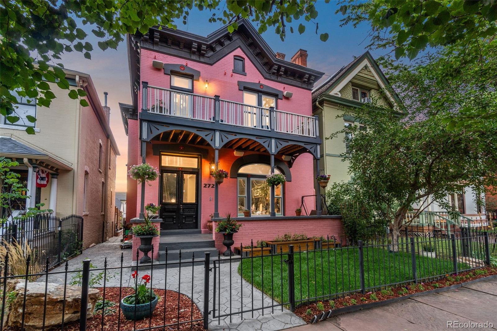 This one-of-a-kind home, situated on a quiet tree-lined street of stately Victorian residences in historic Curtis Park, lies just a few blocks from the center of RiNo. Step into 2721 Curtis and be transported to a playful, relaxing oasis in the city. With original walnut staircase, wide plank pine floors, cast-iron fireplaces, over 10-ft ceilings, and ornate woodwork, this home retains the beauty and integrity of its Victorian roots. Nearly every light fixture is a hand-selected 1800s antique, including museum-quality railcar light fixtures, rare pieces of history. Update systems! A state-of-the-art whole house sound system, with 45 speakers throughout, offers sound control in every room. Wired for the future with gigabit internet. Its eight, 4k camera suite enables monitoring from a simple app. A new, state-of-the-art commercial heat pump HVAC system, with controls for each floor. Navien on-demand water heat system. With over 4300 finished sqft, the house has plenty of room to entertain, live and work. The large kitchen showcases a center island, marble countertops, farm style sinks, stainless appliances, and a large custom pantry. The second floor features a library, three bedrooms and two baths. The primary suite on the second floor boasts a decorative fireplace, a relaxing balcony overlooking Curtis Street, and a beautiful ‘blue celeste’ Argentinian marble bath with a walk-in, rainfall shower and Rohl fixtures. The third-floor primary suite with en-suite bath features custom top-of-the-line, mahogany Loewen windows and French doors opening to a balcony with stunning mountain and city skyline views. The basement features original stone walls, antique arched doors, reclaimed wood floors, and a granite bar top imported from Madagascar. Home theater with custom, app-controlled lighting and immersive 13-speaker surround sound movie theater with a 72-in TV and tech rack included in sale. Separate exterior entrance to basement offers potential for rental income.