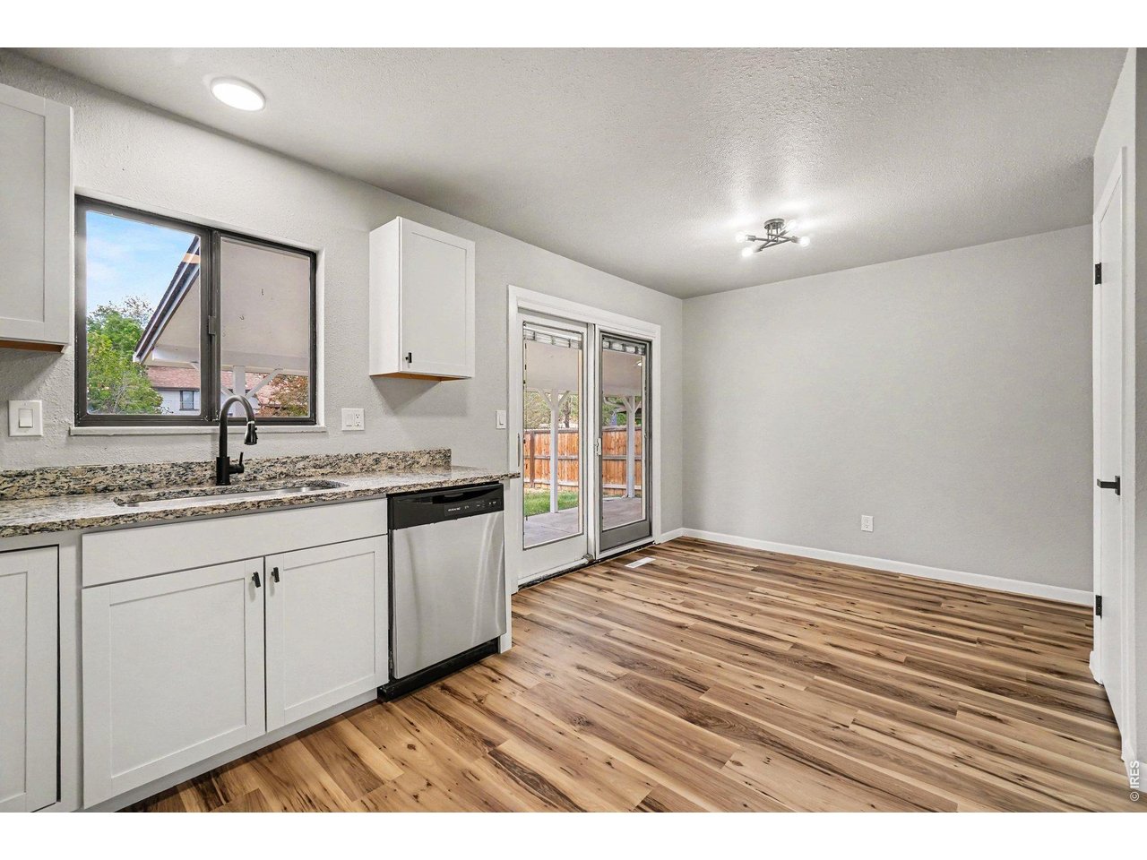 Beautifully remodeled 3-bedroom, 2-bath home offering approximately 1,700 square feet of comfortable and stylish living space. This move-in ready property showcases extensive updates throughout, creating a fresh, modern feel while maintaining a warm and inviting atmosphere. The main living areas are bright and open, providing a functional layout ideal for both everyday living and entertaining.The kitchen offers ample cabinet and counter space, making it both practical and welcoming for gatherings. Generous bedrooms provide flexibility for family, guests, or a home office setup. Downstairs, a large family room adds valuable additional living space-perfect for a media room, game area, or separate retreat.Step outside to enjoy the covered patio overlooking a spacious backyard, offering plenty of room for outdoor entertaining, gardening, or simply relaxing. The yard provides excellent potential for customization to fit your lifestyle.Conveniently located close to shopping, schools, and everyday amenities, this home combines modern updates, functional space, and a desirable location. A great opportunity for buyers seeking a move-in ready home with room to grow.