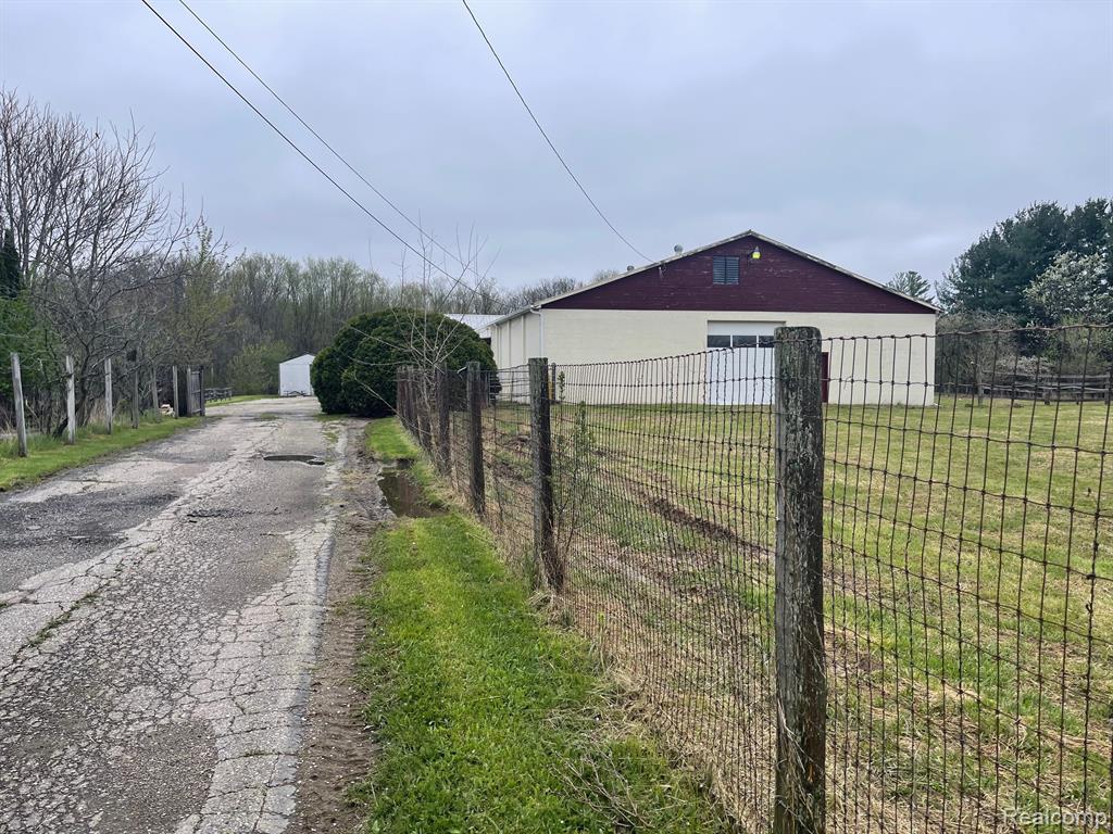Showings by appointment only. Location, Location, Location! 8 + acres on Fenton Road S. of Grand Blanc Road. Property includes a main building with 12,657 square feet, plus 3,110 square feet in out buildings including; 50x130 indoor arena withobservation room, observation room has bath, kitchenette and office, barn, haybarn, stable with 10 boxstalls (10x10), 4 stalls (10x12), wash rack, tack room, grain room. Shed with wood floor. The garageworkshop area has two 12" doors with additional mezzanine for storage. The apartment/office area has a 11/2 bath, kitchen space and sitting area. Beautiful peaceful views of the pasture area from the mainbuilding. Fenced area on the South side with outdoor arena and additional pasture area. Grand BlancSchools. BATVAI