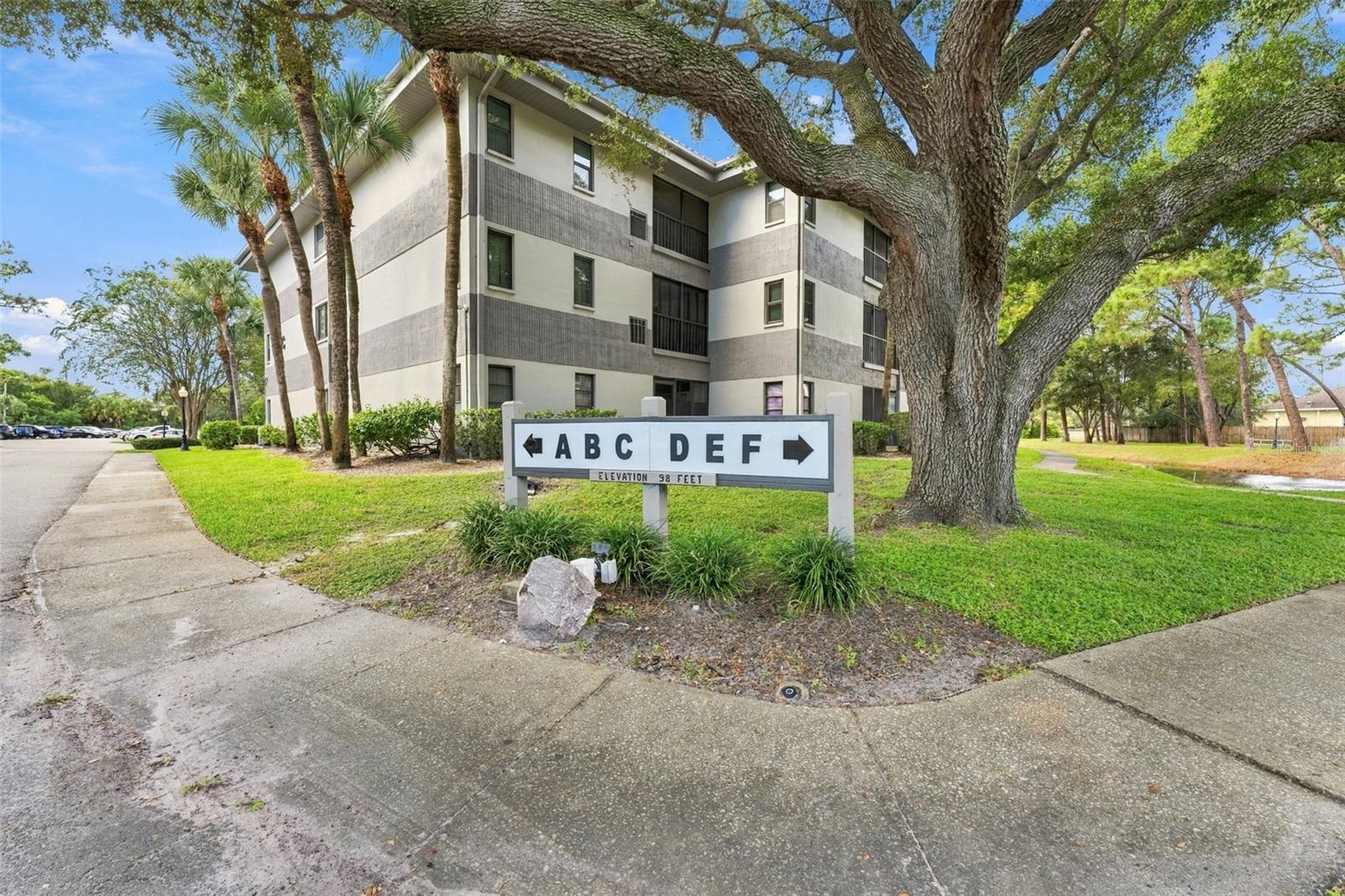 Stunning 3rd floor condo in the heart of Clearwater. Luxury finishes, exceptional craftsmanship, and an unbeatable location! Welcome to this absolutely stunning, completely remodeled residence in the serene Rustlewood community. This exceptional 2-bedroom, 2-bath condo offers the perfect combination of sophisticated design, modern conveniences, and effortless Florida living. Every detail has been thoughtfully selected to create a home that feels like brand-new construction! Step inside and prepare to be impressed! Gorgeous, oversized, high-end porcelain tile flows seamlessly throughout the entire residence, complemented by all-new interior doors, designer lighting fixtures, and stylish ceiling fans. The beautifully reimagined kitchen features custom gray cabinetry with elegant under-cabinet lighting, luxurious quartz countertops, stainless steel appliances, a sleek black granite sink, and a spacious breakfast bar with additional 12-inch-deep storage cabinetry underneath. This thoughtfully designed space offers the perfect balance of beauty, functionality, and everyday convenience. Both bathrooms have been completely transformed! The primary and guest bathrooms showcase lush blue vanities topped with quartz countertops, oversized shower tile, sleek sliding glass shower enclosures, and high-end touch-activated illuminated mirrors. These beautifully coordinated finishes are rarely found in condominium living in this price range.  The spacious primary suite has a generous walk-in closet, and a beautifully appointed private bathroom. The second bedroom provides comfortable accommodations for all. Step onto your  screened patio overlooking the peaceful surroundings. Complete with a convenient storage closet and Plexiglas sliding panels, this wonderful outdoor retreat can be enjoyed in a variety of weather conditions. Major upgrades provide added peace of mind. Enjoy a brand-new AC, 24 water heater & new electrical panel. The elevator is conveniently located directly across the hall, making third-floor living exceptionally accessible. The condo is not located in a flood zone. LOCATION X 3! Enjoy the convenience of being within walking distance of Clearwater Mall, countless shopping destinations, and an outstanding selection of casual and fine dining. Outdoor enthusiasts will appreciate immediate proximity to the Duke Energy Trail, perfect for walking, jogging, and cycling. Just five minutes away, charming downtown Safety Harbor offers boutique shopping, wonderful restaurants, its popular Third Friday celebrations, and a calendar filled with community festivals and special events throughout the year. Philippe Park is approximately 10 minutes away, while Tampa International Airport is approximately 20 minutes away and St. Pete–Clearwater International Airport is just 10 minutes away, making travel a breeze!  Easy, low-maintenance Florida living with the monthly condominium fee covering escrow reserve funding, building insurance, basic cable, access to the community swimming pool, building and grounds maintenance, water, sewer, and trash service. An extraordinary opportunity you won't want to miss.  With its extensive top-to-bottom renovation, upscale finishes, outstanding location, this residence offers exceptional value. The sellers have lovingly transformed this property not expecting to sell. Schedule your private showing today and discover why this remarkable residence is truly a standout!