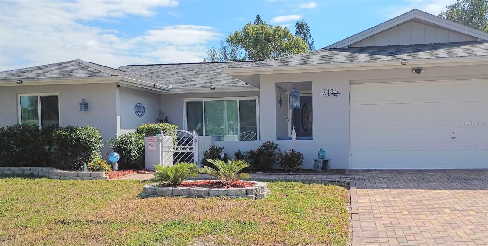 A kitchen made for gathering, a pool made for relaxing, and beautiful updates throughout. This immaculately maintained Orchid Lake Village home offers 1,442 square feet of living space with no HOA or CDD fees. A new roof, impact rated windows, and a newer HVAC system add to the extensive improvements.A paver driveway offers plenty of parking, with an attached garage providing additional space for two cars. A welcoming front courtyard sets the tone for what awaits inside. The expansive modern kitchen features upgraded cabinetry with abundant storage, granite countertops, a center island, and a dedicated pantry. Generous counter space and open living and dining areas make cooking and entertaining easy. Ceramic tile flooring throughout simplifies everyday care.Two bedrooms and a separate den provide flexibility for a home office, TV room, or hobby space. The primary bedroom includes a walk in closet and a spacious bathroom with a walk in shower. The Florida room offers another comfortable place for morning coffee or tea, reading, or catching up with friends.Outside, the newly refinished pool features glass tile accents and a new pump. Relax on the covered porch between swims or enjoy dinner outdoors, with a separate covered grilling area for preparing your favorite meals. Newer vinyl fencing encloses the backyard for exceptional privacy.With so much to enjoy inside and out, your favorite place to spend the weekend might just be home.