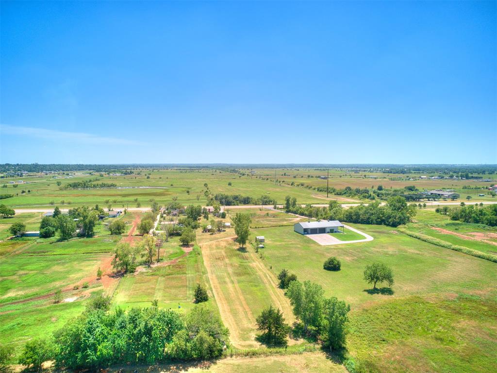 Nestled on over 2 scenic acres, this beautifully updated home offers the perfect blend of rural tranquility and modern accessibility. Enjoy peaceful country views while being only minutes from I-35, shopping, restaurants, and entertainment. Inside, you'll find gorgeous ceramic tile throughout and a spacious floorplan that's ideal for hosting family and friends. The kitchen is both functional and stylish, featuring granite countertops, a new gas stove and dishwasher, and plenty of prep and storage space. Additional updates include a newer roof, newer water heater, fresh exterior paint, and an aerobic septic system for peace of mind. An electric shop/shed offers extra room for hobbies or storage. Located in a popular school district, this property truly offers the best of both worlds—serene rural living with all the conveniences of town just minutes away. Don’t miss your chance to own this rare gem!