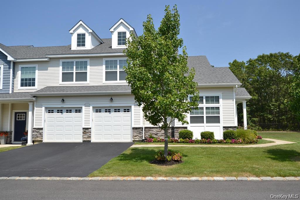 Oversized and magnificent, this Moscato end unit is the largest model in the Vineyards at Brookfield. This premium home offers two spacious bedrooms plus a versatile bonus room, all within an open, dramatic floor plan. The kitchen features a center island, striking black Bosch appliances, a pantry, and flows seamlessly into the dining room and living area with its modern gas fireplace and stunning  hardwood floors. The primary bedroom boasts elegant tray ceiling, and throughout the home you’ll find upgraded finishes, including a full-size Electrolux washer and dryer and a custom barn door. This is truly a designer’s delight, prettier than a model home, with just too many upgrades to list.
The dramatic loft and catwalk overlook the main living space, while soaring ceilings and wooded side and backyard views create an airy, private feel. Step outside to a paver patio with a custom awning. The full, finished basement is an entertainer’s dream, complete with a bar, dining area, great room, and separate bedroom space. Additional highlights include 3.5 bathrooms, a two-car garage, gas heat, and an alarm system.
The Vineyards at Brookfield offers resort style amenities in a vibrant 55+ gated community, including a beautiful clubhouse with billiards, a card room, catering room, yoga studio, gym, and fireplace lounge. Outdoors, enjoy a heated pool with an attendant. Premium location, largest floor plan, and luxury finishes make this home a must see.