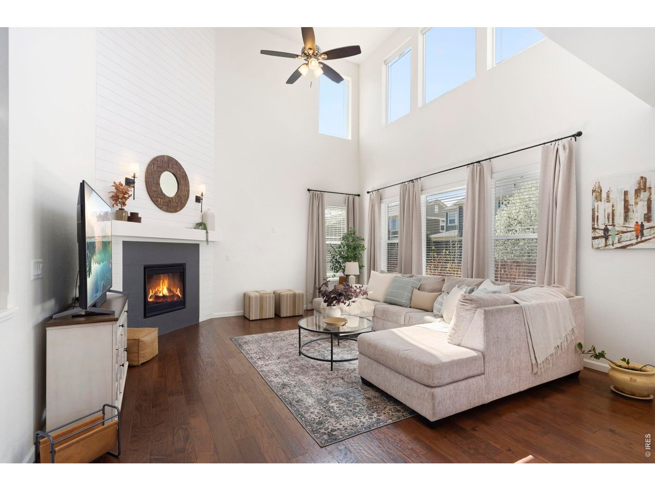 The value is undeniable, but it's the feeling of this home that will win you over. Thoughtfully designed, beautifully finished and impeccably maintained, this is the kind of home that simply feels right from the moment you walk through the door. From the inviting front porch to the custom details throughout, this isn't a home you'll forget after touring a dozen others. Step inside to an elegant entry and private main-floor office with French doors before discovering the true showstopper...a stunning kitchen designed to be the heart of the home. Gorgeous cabinetry, stylish countertops, a generous island, and seamless flow into the dining area and great room create a space that's equally suited for lively gatherings or quiet evenings. Expansive windows, motorized shades, a striking fireplace and dramatic ceilings flood the home with natural light, while designer lighting, custom wainscoting, shiplap accents and hand-scraped wood floors add character at every turn. Upstairs, all four bedrooms are thoughtfully tucked away along with the laundry room. The spacious primary suite feels like a boutique hotel retreat, complete with a luxurious five-piece bath and two walk-in closets. Bedroom two enjoys a private ensuite, while bedrooms three and four share a Jack-and-Jill bath. The open staircase continues to a partially finished basement offering a comfortable family room, abundant storage and room to create whatever comes next. Out back, you'll find the kind of backyard people actually use...a covered patio, built-in fire pit and beautifully landscaped yard that makes staying home feel like the best plan. Perfectly located near Bacon Elementary with quick access to the Harmony Corridor and I-25, this home delivers the style, function and location buyers are searching for. The photos are impressive. The craftsmanship is even better. Come see for yourself why this home stands apart.