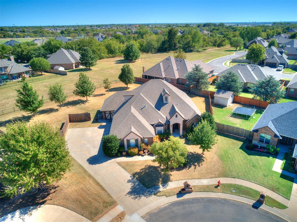 This spacious 4-bedroom, 2 Full bath, 2 half-bath, 2 Living and Office offers 2,834 square feet of living space on a half-acre lot that backs up to the greenbelt. This home features a beautiful living room with vaulted ceilings, exposed wood beams, and a fireplace, along with a spacious kitchen featuring granite countertops, stainless steel appliances, and abundant cabinet space in the kitchen and hallways. Including a dedicated study, bonus living space, and outdoor entertaining area with a covered patio and fireplace. Additional features include a below-ground storm shelter, whole home surge protector, sprinkler system, and recent HVAC updates.  Located in the gated Williamson Farms community, residents enjoy access to pools, a clubhouse, walking trails, and other neighborhood amenities. Don’t miss the opportunity to make this wonderful property your next home!