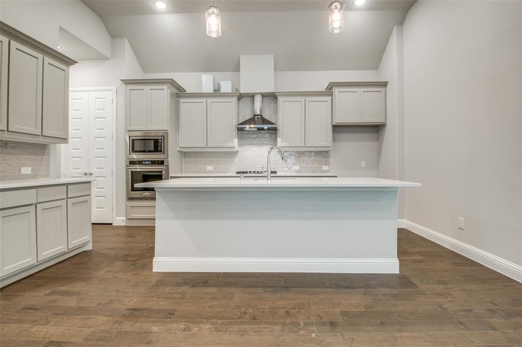 Incredible recent Trophy's ONE STORY SINGLE HOUSE ready for immediate occupancy. Master planned community of the Park Vista offers an open floor plan for sale.  Rare opportunity to live in this SINGLE-STORY floor plan with open and bright kitchen dining living with white cabinets and quartz countertop. Wood flooring invites you from foyer all throughout living area. The master bedroom has a separate walk-in closet for his and hers. Pinot is a classic design balancing structure with a dash of panache. The open floor plan is airy and bright with gorgeous windows offering an unobstructed view of your covered patio. The community boasts parks to play in, sports courts for challenging the kids. Close proximity to highly ranked Frisco ISD and major highways as well as new developments all over Frisco.
