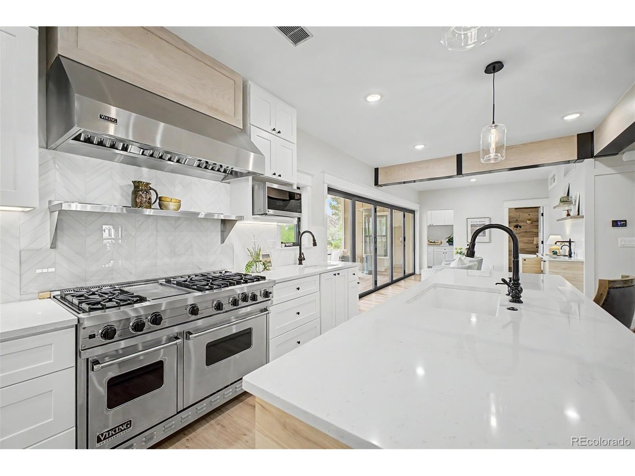 **Some homes simply need to be experienced. This is one of them.** Photos cannot capture the feeling, craftsmanship, and extraordinary indoor-outdoor connection of this one-of-a-kind custom home. **A true must-see.**Set against protected Boulder open space with trails just outside your door, this remarkable home blends sophisticated design with an effortless Colorado lifestyle. Open the expansive moving glass wall and the home transforms-bringing the outdoors, patio, and open space seamlessly into your living experience.Inside, every detail has been thoughtfully considered. A true chef's kitchen features a **Viking range**, while the beverage bar with **instant hot water** makes entertaining effortless. Step outside to the covered patio and **outdoor kitchen**, designed for long summer evenings and memorable gatherings.Upstairs, discover a unique **New York brownstone-inspired feel**, with generously sized bedrooms, distinctive colored doors, individual mail slots, charming exterior-style lighting, and ensuite baths throughout. Ideal for guests, multigenerational living, or simply giving everyone their own private retreat.And then there is the location-**trails at your doorstep, protected open space behind you, shopping and dining nearby, and an easy commute to both Boulder and Denver. A one of a kind Superior location.**This isn't a cookie-cutter luxury home. **It has personality. It has soul. And it has to be seen in person to truly appreciate what makes it so special.** 314 W. Charles, lot in front of home can be purchased as a package, income potential, some neighbors are getting 8-10K/mo. with their short-term rentals.**Don't judge this home by the photos. Come experience it. You may find yourself wondering why you waited.****312 W. Charles Street - truly a home that must be experienced.** Please see videos!This is Colorado Living!