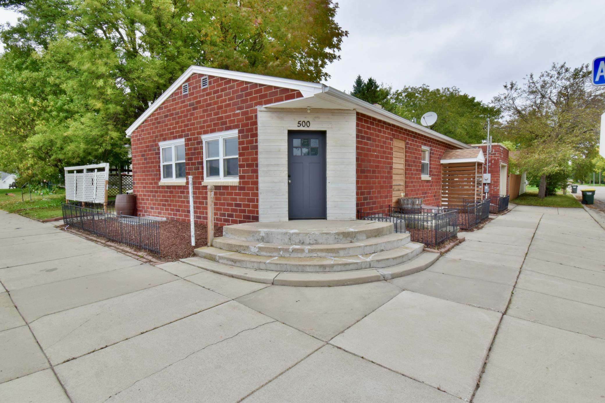 Incredible opportunity awaits at 500 Atlantic Ave! Offering ultimate flexibility, this property functions seamlessly as a single-family home with a private mother-in-law suite or as an income-generating duplex with proven cash flow history ($1,350/mo for the main floor and $1,300/mo for the lower level). Over the past several years, the home has undergone extensive interior, mechanical, and safety transformations.The main level features fresh interior paint, updated lighting, new laminate flooring, and brand-new carpet in the living room (2026). The updated kitchen boasts new appliances (2023), granite-look backsplash, and a new sink. The main floor full bathroom has been fully updated with a new vanity (2026), toilet, sink, custom tiled shower surround, ceiling accent, and new bath fan. The main level primary bedroom offers a freshly finished walk-in closet.The lower-level features resurfaced basement entrance steps and has been completely transformed with new drywall, insulation, baseboards, brand-new carpet (2026), and new tile in the hallway and laundry room, along with a new washer and dryer (2023). The full kitchen update in 2023 featured new cabinets, sink, and appliances. Plus, enjoy peace of mind with split/rewired electrical panels (2023), new egress windows in every lower-level room, and a comprehensive water management system—complete with additional drain tile, a drain by the basement stairs, new sump pump with battery backup, and an inspected wall system (2025). Outside, enjoy refreshed concrete stairs and new garage door openers on the detached garage. Served by the Willmar Public School District (ISD 347), you are just 10 minutes from Willmar via Hwy 12 for shopping, dining, and healthcare. Schedule your showing today!