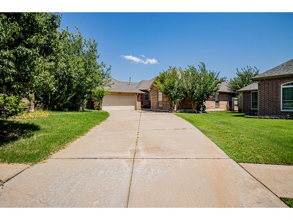 Great home in the desirable Woodvine neighborhood, offering privacy and comfort. Backing up to a peaceful open field, the covered back patio is your personal retreat—complete with charming caf&#233; lights for relaxing evenings or entertaining. Inside, the open-concept layout connects the kitchen and living room, featuring hand-scraped wood floors that extend through the living area, study, hallway, and spacious master suite. The two secondary bedrooms are carpeted for added comfort. A true study with a large closet provides the perfect work-from-home space or flexible bonus room. The master bedroom is generously sized with patio access, a large bathroom, and a walk-in closet. Each secondary bedroom also includes walk-in closets, offering plenty of storage throughout the home.
Recent upgrades include a brand-new HVAC system (Dec. 2024) and a new hot water tank (Jan. 2023). A storm shelter is installed in the garage for peace of mind. Don’t miss your chance to own this move-in ready gem in a quiet, convenient location!