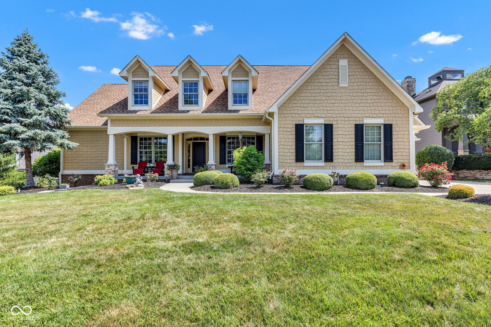 Welcome to this stunning 5 bed, 4.5 bath Cape Cod style home in the coveted Herron Knoll section of Hamilton Proper, offering over 5,000 sq ft of beautifully finished living space. Nestled on a professionally landscaped 0.5-acre corner lot, this residence offers a seamless blend of sophistication, functionality, and resort-style amenities. Step inside to a light-filled main level designed for both comfort and entertaining. Soaring ceilings, rich architectural detail, and a fluid open floor plan set the tone. Two distinct living areas-both with gas fireplaces-anchor the space. A dedicated home office tucked just enough away for privacy. The gourmet kitchen is as stylish as it is functional, with a large center island, black galaxy granite counters, built-in stainless steel appliances, and updated cooktop/vent (2024). Off the kitchen, the formal dining room offers an ideal setting for both intimate dinners and larger gatherings. The main-level primary suite is a peaceful retreat, remodeled in 2024 with dual vanities, a stand-alone soaking tub, tiled shower, and walk-in closet. Upstairs, 3 additional bedrooms feature walk-in closets and private or Jack-and-Jill bathroom access. The finished basement is an entertainer's dream with a wet bar, home theater, game room, gym, and guest suite with full bath-perfect for hosting visitors in style. Step outside to your private backyard oasis with a heated in-ground pool, stamped concrete patio and firepit, and Trex deck. Mature trees and professional landscaping provide year-round beauty and privacy. Additional features include a 3-car garage with electric heaters and epoxy floor (2023), whole-home fiber optic surround sound, and major mechanical updates: furnace, A/C, upstairs damper, water heater, water softener (2022-25), full pool system upgrades (liner, pump, motor, chlorinator), and more. Meticulously maintained and move-in ready in one of Fishers' most desirable golf communities-Hawthorns Golf & Country Club.