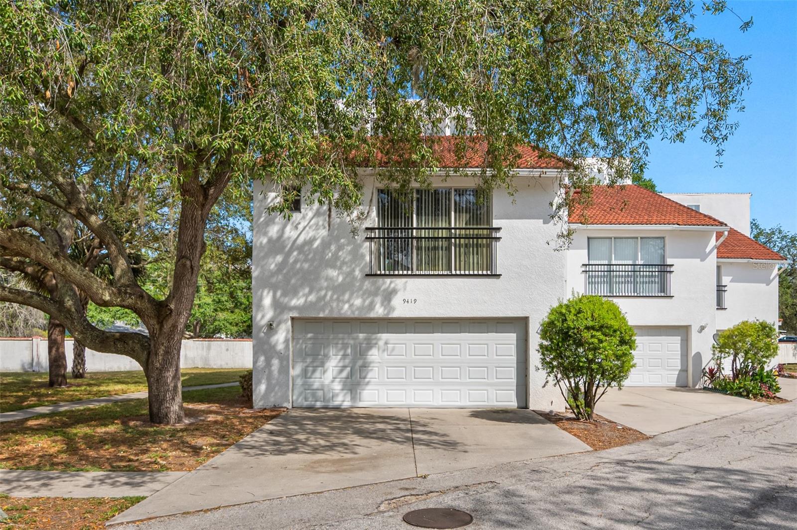 Experience refined living in this beautifully appointed tri-level corner townhome located in the heart of Carrollwood. Offering 3 bedrooms and 3.5 bathrooms, this home combines modern elegance with thoughtful design.The main living area welcomes you with an open-concept floor plan, soaring vaulted ceilings, and an abundance of natural light that fills the space. The kitchen is both stylish and functional, featuring granite countertops, rich cabinetry, and stainless steel appliances—perfect for entertaining or everyday living.What truly sets this home apart? Each bedroom is a private retreat, complete with its own en suite bathroom, providing comfort and convenience for everyone. A well-placed half bath on the main level adds an extra layer of practicality for guests.As a highly sought-after corner unit, enjoy added privacy and extra windows that create a bright, airy feel throughout. Located in desirable Carrollwood, you’re just minutes from top dining, shopping, and major roadways.Opportunities like this don’t come often—schedule your private showing today!