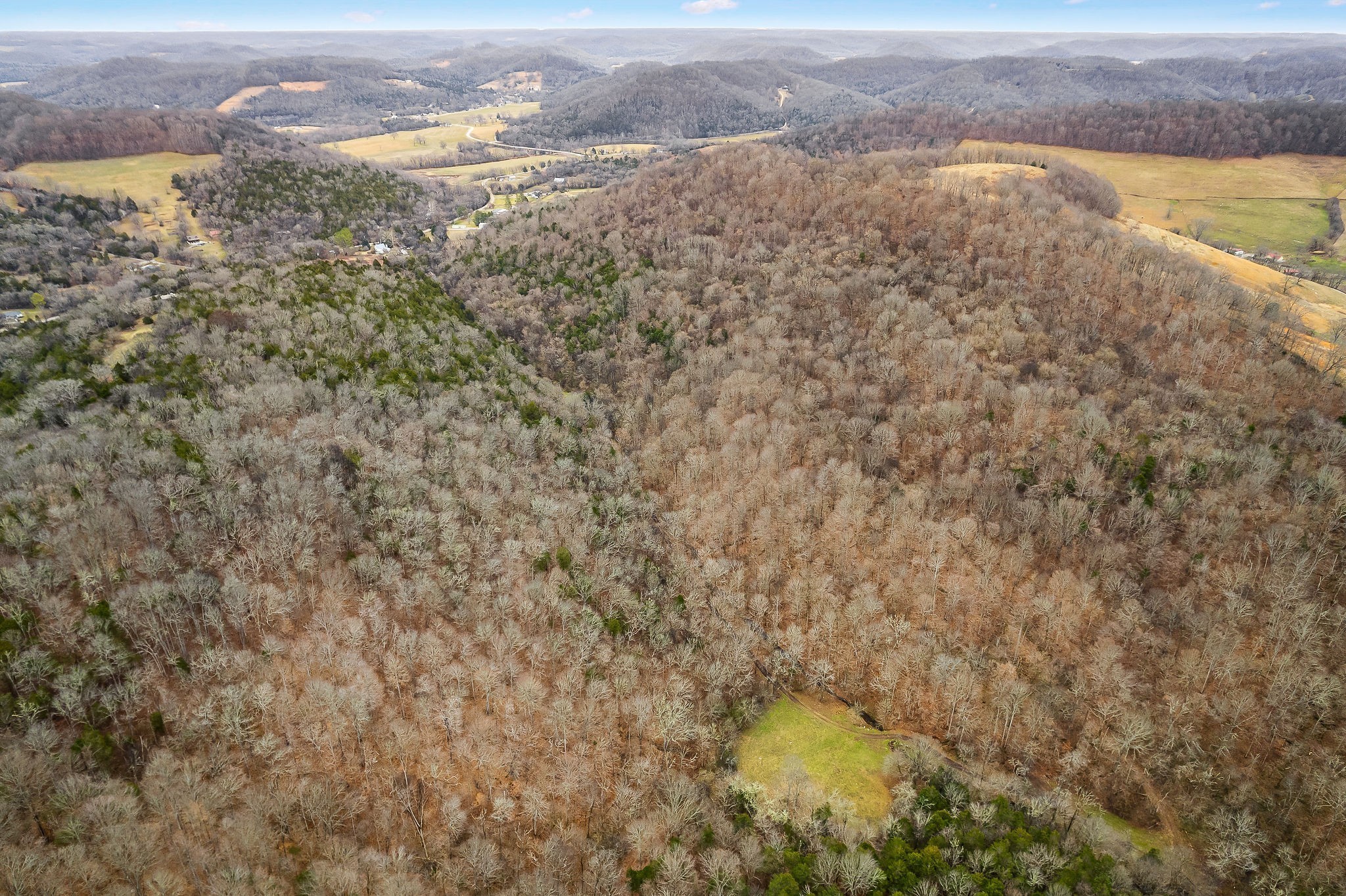 Come check out this extremely rare opportunity, to own an outdoorsman's and hunter's paradise, with miles and miles of atv trails and marketable timber. This property features 361 acres, numerous barns and storage sheds, and a beautiful creek running through it. Land is located just 50 minutes from the Nashville Airport, 20 minutes from Center Hill Lake, 10 minutes from the Caney Fork River. Seller will entertain owner financing with $500,000.00 down and 7.9% interest up to 30 years. The seller will also entertain a trade in properties. We are available 24 hours a day and 7 days a week to show. This would make an excellent short term rental with its convenient location.