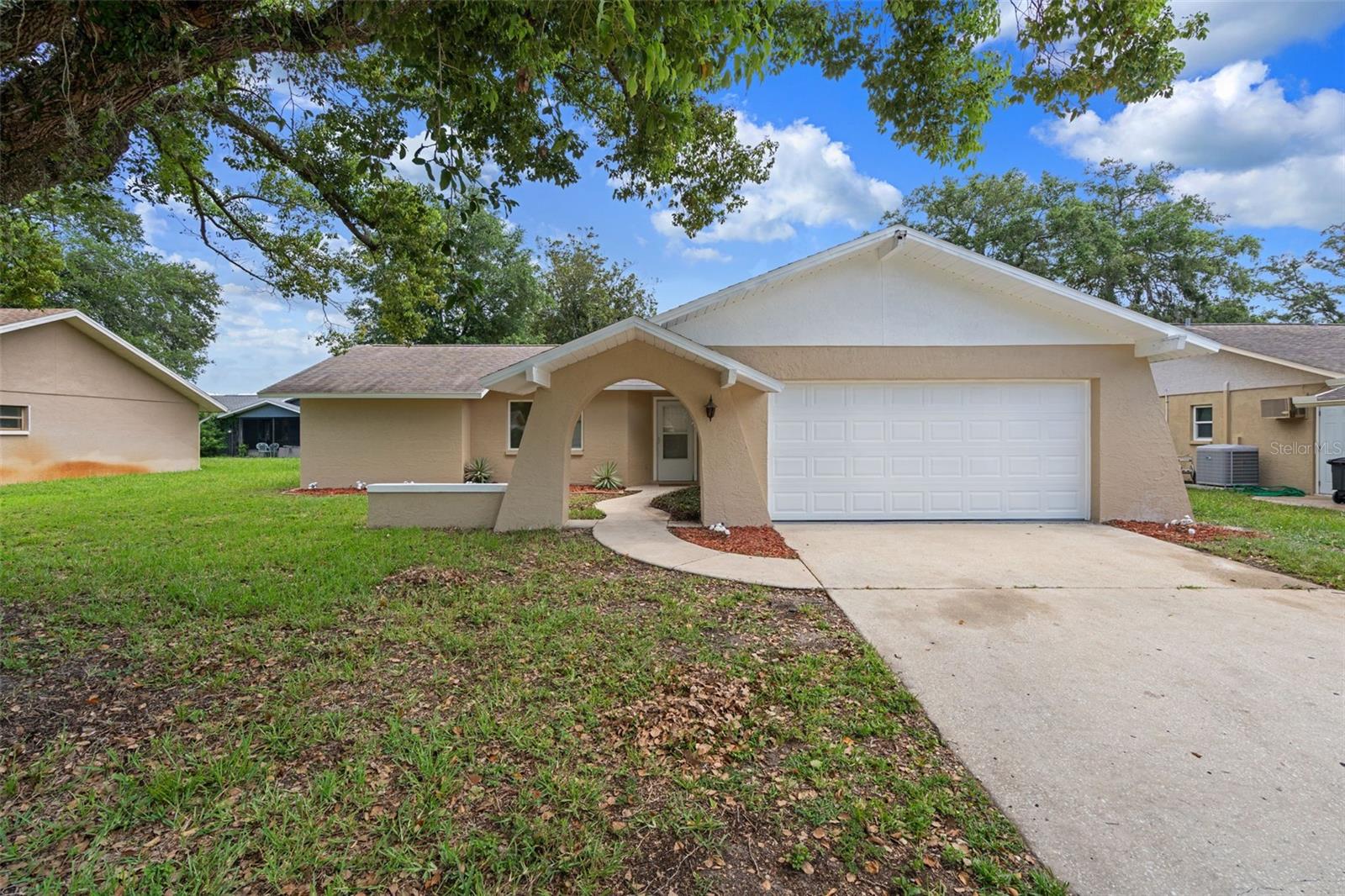Welcome to this stunning, completely remodeled home in the highly desirable community of Greenbrook Estates! This move-in ready 2-bedroom, 2-bathroom home offers 1,388 sq/ft of beautifully updated living space with a 2-car garage and showcases high-end finishes throughout. From the moment you step inside, you'll be impressed by the brand-new luxury vinyl plank flooring (2026), fresh interior and exterior paint(2026), new doors throughout, updated lighting, modern fixtures, and designer touches at every turn (2026). The heart of the home is the gorgeous, fully remodeled kitchen (2026) featuring elegant quartz countertops, shaker cabinets, stainless steel appliances, a stylish tile backsplash, an eye-catching Art Deco accent wall, and all-new hardware and fixtures. Both bathrooms have been completely renovated with today's most sought-after finishes. The spacious primary suite has a large walk-in closet and boasts a luxurious walk-in tiled shower complete with a built-in bench and niche, a new vanity, updated mirrors, lighting, and premium fixtures. The guest bathroom has been equally transformed with a beautiful new tub/shower combination, new tile, vanity, mirrors, fixtures, and lighting (2026). Additional updates include a Roof (2019), A/C (2017) with a brand-new thermostat, giving buyers added peace of mind. Inside laundry room. Enclosed lanei perfect for sipping your morning coffee! Enjoy the benefits of NO flood insurance required, LOW HOA fees, and NO CDD fees. Residents also have access to a community clubhouse and pool. Conveniently located near shopping, restaurants, parks, and entertainment This home truly offers the perfect combination of style, comfort, and location. Don't miss your opportunity to own this COMPLETELY REMODELED MOVE-IN READY HOME!!!! This home will surely check all the boxes!! Schedule your private showing today!