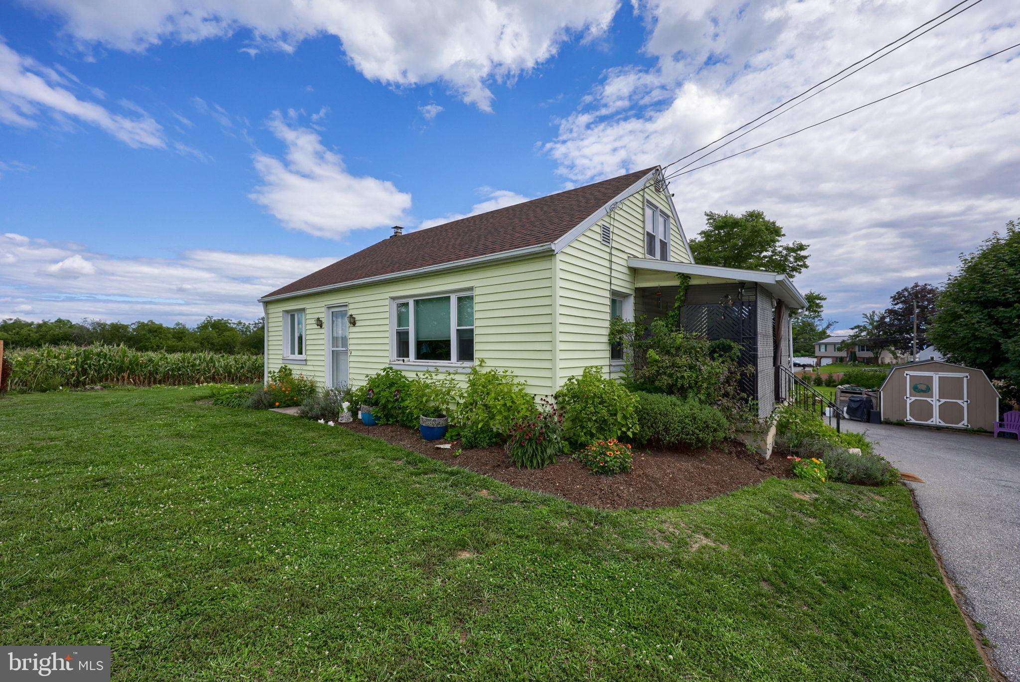 Well-maintained 3-bedroom, 1-bath Cape Cod, tucked away in a quiet neighborhood.  Situated on 0.42 acres, the home offers hardwood floors, central air, replacement windows, a new roof (2023), and an updated electrical panel.  2 bedrooms on main floor and 1 bedroom plus a bonus area that could be used as a 4th bedroom/office on second floor. The spacious, private backyard features fruit trees, an established garden, a detached outbuilding, and a storage shed—creating a wonderful space to relax, garden, or enjoy the outdoors.