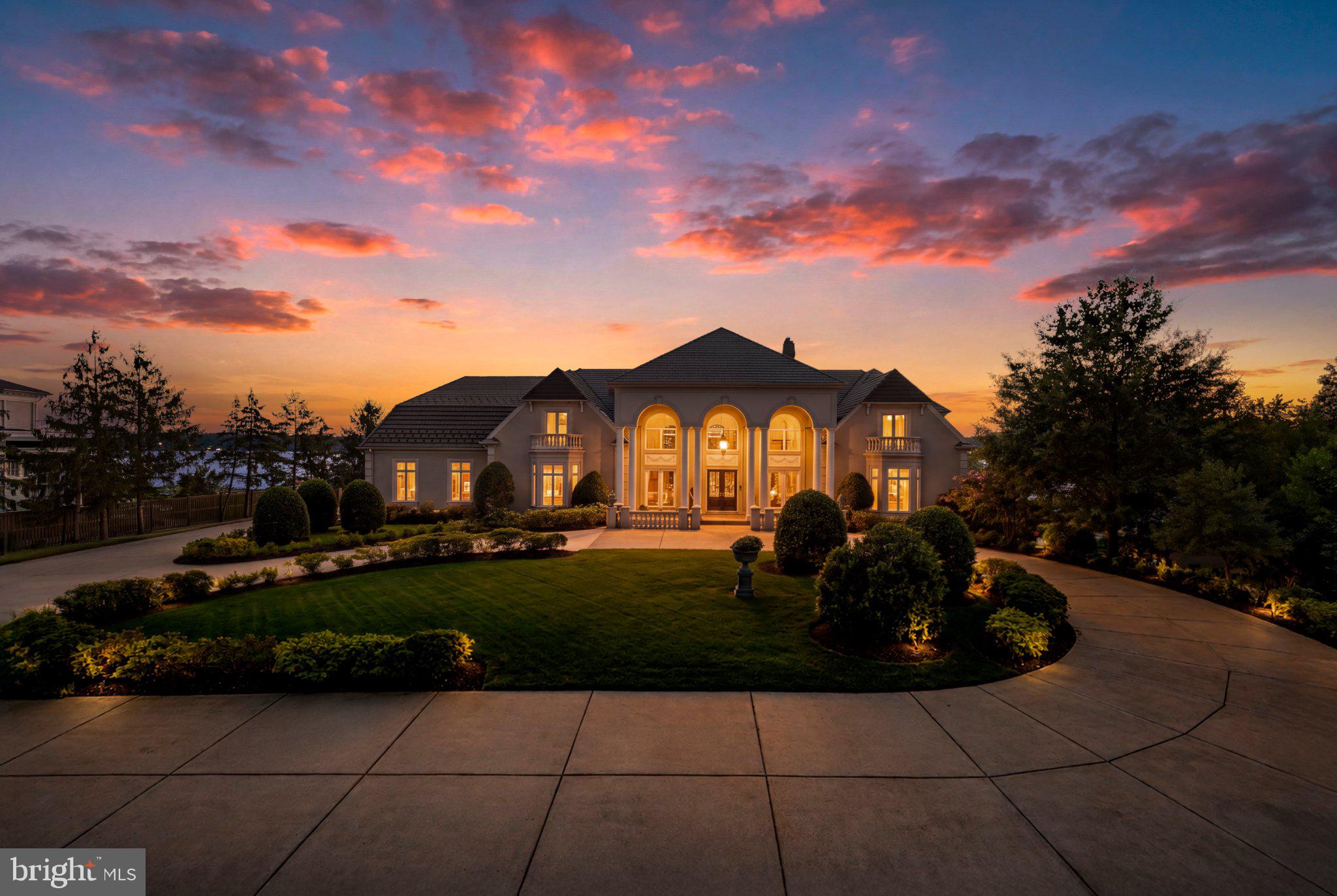A Timeless Waterfront Estate. A Legacy Unlike Any Other.Set along one of the most breathtaking stretches of the Potomac River, 9514 Lynnhall Place is an extraordinary six-bedroom waterfront estate offering a rare combination of privacy, scale, grandeur, history, and natural beauty. Positioned on more than two beautifully manicured acres, the residence captures sweeping panoramic views extending for miles down the Potomac, with an exceptional orientation looking along the river rather than simply across it.The property's story is equally remarkable. The estate was built on one of President George Washington's five original Mount Vernon farms, The Union Farm, connecting it to the history of one of America's most significant estates. A plaque near the front entrance recognizes the property's historical significance.Originally commissioned by the late Major General Guy L. Hecker Jr., a decorated United States Air Force fighter pilot and two-star general, the residence was constructed over nearly three years by builder Ty Chambers. The entire residence was featured in Veranda Magazine, a fitting recognition of its distinctive architecture and exceptional design.Beyond the stately entrance and circular driveway, soaring columns introduce interiors of impressive scale and artistry. A dramatic dual floating staircase is complemented by hand-painted frescoes, a striking rose quartz hallway, crystal chandeliers, graceful archways, rich millwork, soaring ceilings, a beautifully crafted built-in mahogany library, and seven fireplaces.Expansive windows and thoughtfully positioned living spaces capture spectacular Potomac views from nearly every principal room. Four staircases and an elevator serving every level provide seamless access throughout the residence.The chef's kitchen features premium Thermador appliances and flows naturally into the surrounding living and entertaining spaces. The walkout lower level is anchored by a spectacular custom mahogany bar and a dramatic double-sided fireplace. A private movie theater, fitness room, sauna, steam room, multiple wet bars, and expansive recreation spaces create the experience of a private resort.The residence offers six bedrooms in total, including a separate upper-level au pair suite with its own bedroom, kitchen, living room, and private staircase. The primary suite is a serene waterfront retreat with beautiful river views, spa-inspired baths, generous dressing areas, and exceptional privacy.Outside, extensive excavation and landscaping created a graceful transition from the residence to the water's edge. Expansive terraces overlook the resort-style pool and spa, while a private deep-water dock provides direct access to the Potomac River.Additional features include a heated three-car garage, laundry facilities on every level, multiple HVAC zones, and exceptional custom craftsmanship throughout.Ideally located minutes from George Washington's Mount Vernon Estate, Old Town Alexandria, National Harbor, Reagan National Airport, and Washington, D.C., this remarkable property combines the serenity of a grand waterfront retreat with exceptional access to the nation's capital.Rare in its scale. Remarkable in its craftsmanship. Rich in history. Irreplaceable in its setting. 9514 Lynnhall Place presents an exceptional opportunity to own one of the Potomac River's most distinctive waterfront residences.