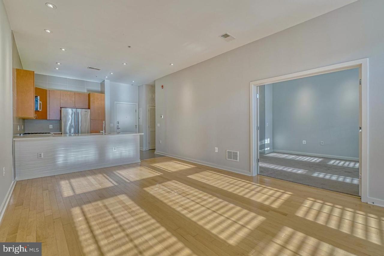 Discover Urban Sophistication at Twelve09 N Charles – Unit 309Experience the pinnacle of Mount Vernon luxury living in this stunning 1-bedroom, 1-bathroom condo featuring an open floor plan, gleaming hardwood floors, and abundant natural light. The gourmet kitchen showcases stainless steel appliances and ample storage, while the spacious bedroom includes a generous walk-in closet and private en-suite bathroom.As a resident of the prestigious Twelve09 N Charles building, you'll enjoy exclusive amenities including secure entry, your own assigned underground garage parking space, designated storage locker, on-site fitness center, and a beautifully landscaped courtyard oasis. This classically modern building seamlessly blends with Mount Vernon's historic architecture while offering contemporary conveniences.Added Peace of Mind: The owner has graciously completed a comprehensive pre-inspection by a licensed home inspector, ensuring this property is move-in ready and meticulously maintained. This means you're renting a unit that meets the highest standards with complete transparency about its excellent condition.Your location is unmatched – steps from Baltimore's renowned Penn Station (currently undergoing major renovations to enhance connectivity), University of Baltimore, world-class dining, theaters, and cultural attractions. At $2,000 per month with gas heating, water, and garbage included, plus the ongoing Penn Station Investment and Development Program elevating the neighborhood, this exceptional rental with garage parking represents extraordinary value in Mount Vernon's premium rental market.