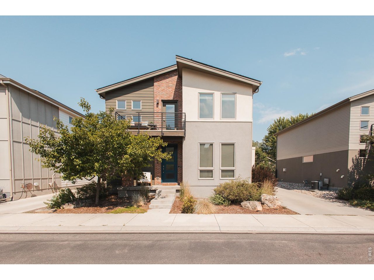Tucked away in the hidden enclave of Streamside, where modern architecture meets one of Fort Collins' most walkable locations, 1664 Sprocket Drive offers an exceptional opportunity to live moments from Old Town while enjoying the privacy and tranquility of a secluded neighborhood. Bordering the Spring Creek Trail, this thoughtfully designed community is one of the city's best-kept secrets, offering a low-maintenance lifestyle without sacrificing connection to nature or the vibrance of Downtown. Built in 2015 w/ lasting quality & contemporary design, this meticulously maintained home has been thoughtfully updated throughout. Rich new hardwood flooring flows through the living spaces, complemented by beautiful granite countertops, a new dishwasher, range, and washer / dryer. Additionally 1664 Sprocket features three modern bathrooms. The primary suite is a true retreat, featuring radiant floor heat & a luxurious steam shower. Designed for effortless indoor-outdoor living, the home offers two private balconies along with an expansive rooftop deck, with a new garage roof as of August 2026, prepped and ready for a hot tub. Don't miss the Tesla solar panels, generating an average of 20kWh / day. Whether you're entertaining friends, enjoying your morning coffee, or unwinding after a day on the trail, you'll be treated to sweeping, unobstructed sunset views in the heart of the city. Step outside your front door and enjoy direct access to the Spring Creek Trail, perfect for walking, running, or biking. Whole Foods, local cafes, breweries, restaurants, Midtown, and the charm of Old Town are all just minutes away, making it easy to embrace the connected, active lifestyle that makes this location so desirable. Rarely does a home combine sophisticated design, low-maintenance living, outstanding outdoor spaces, and one of Fort Collins' most coveted walkable locations. 1664 Sprocket Drive is a lifestyle centered around connection, convenience, and the very best of Colorado living.