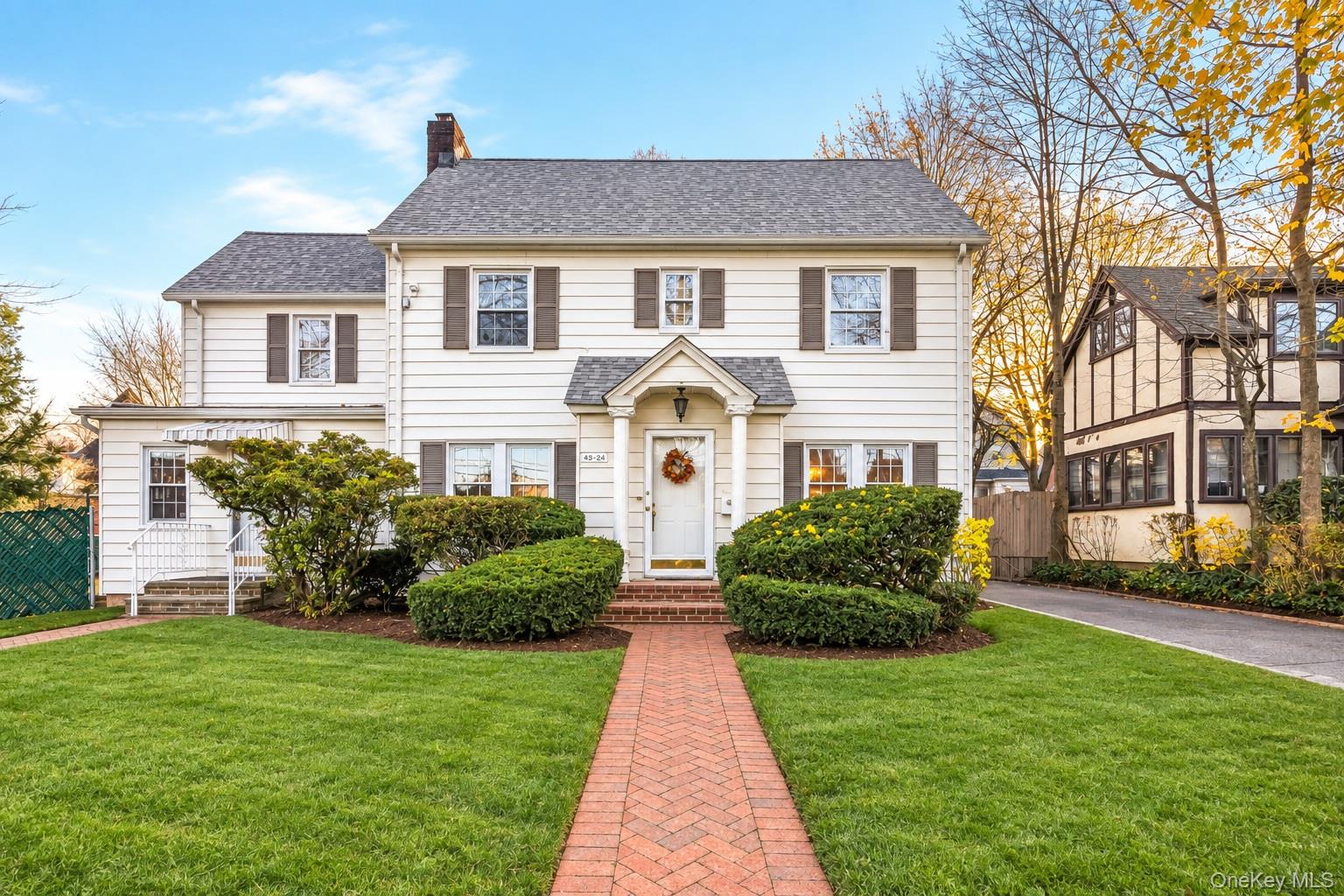 Extra-large detached center-hall colonial with a bonus legal doctor's office permit in the heart of prestigious Little Neck.  Over 3,100 sq ft of space on a 61x100 lot.  The main residence features a gracious living room with fireplace, formal dining room, eat-in kitchen with breakfast nook, family room, three bedrooms plus an additional flex room.  Additional living space includes a walk-up attic and a full finished basement.  The doctor's office has a separate entrance with its own setup and layout for professional usage.  Close to Local bus (#12, #36, #N20G).  Walk to LIRR.  Excellent school district (PS 94 and JHS 67).  Near restaurants and supermarkets on Northern Blvd.  Convenient to all.