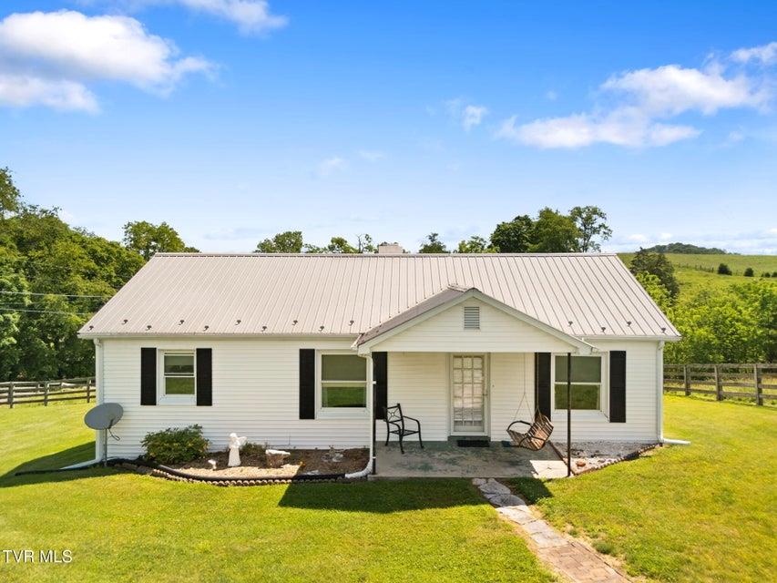 Welcome home to peaceful country living at its finest. Nestled on nearly 5 fenced acres with stunning mountain views and a picturesque creek running through the property, this beautifully maintained 3-bedroom, 1-bath home offers the perfect blend of charm, comfort, and opportunity. From the moment you arrive, you'll be drawn to the inviting front porch complete with a classic porch swing, the perfect spot to enjoy your morning coffee while taking in the breathtaking scenery. Inside, you'll find a spacious and well-cared-for home featuring an open kitchen with tile flooring and beautiful mountain views right from the kitchen window. The property's nearly 5 acres provide endless possibilities, whether you're dreaming of a mini farm, a hobby farm, gardening, or simply enjoying the privacy and space that country living provides. The fully fenced land and flowing creek create an ideal setting for animals and outdoor enjoyment. Relax and enjoy the tranquility of rural living while still being just 20 minutes from town, giving you the best of both worlds. If you've been searching for a property with character, acreage, views, and room to make your homestead dreams a reality, this is one you won't want to miss. Call today for your private showing! Buyers and buyers agents to verify information.