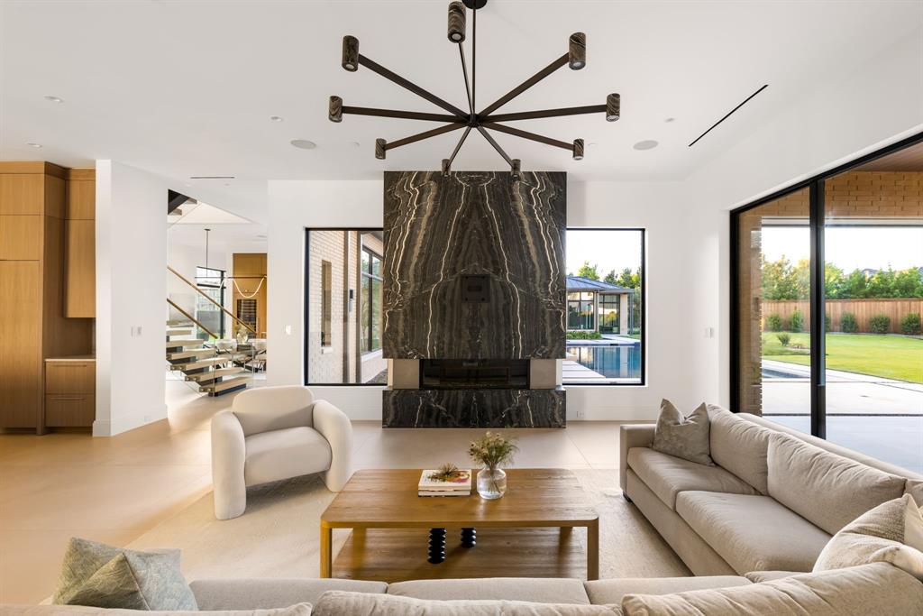 SELLER OFFERING $100,000 Credit to Buyer at Closing for any upgrade of the Buyers choosing.  This home is contemporary luxury living at its finest! This modern home is a masterpiece of new construction, boasting exquisite designer finishes and thoughtful attention to detail throughout. Situated in a coveted part of Preston Hollow, this residence offers the perfect blend of style, sophistication, and functionality. The gourmet kitchen is a chef's dream, featuring top-of-the-line stainless steel appliances, custom cabinetry, quartzite countertops, and a spacious center island with waterfall edges. Large windows flood the home with natural light, illuminating the high-end finishes.

The luxurious spa-like primary includes dual vanities, a soaking tub, separate glass-enclosed shower, and a rejuvenating sauna. Two walk-in closets provides ample storage space, ensuring a clutter-free environment. In addition, the home includes multiple living areas, from formal to informal spaces to adapt to your lifestyle.  The spacious backyard includes a pool, hot tub and fire pit flanking the water.