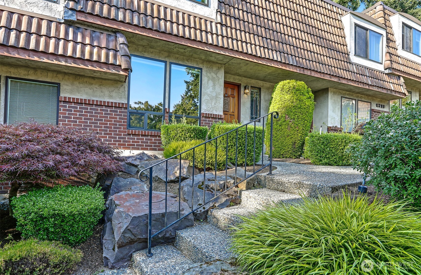Move-in ready 2-bed, 1.5-bth townhouse-style condo located in Edmonds' desirable Villa Royale complex. Main level welcomes you to an inviting liv rm featuring an adorable tiled entry, cozy wood-burning frplc, & hardwood floors. Updated kit offers abundant cabinet & counter space, quartz countertops, soft-close wood cabinetry, newer appliances, & laundry rm w/additional freezer. Excellent layout & all appliances are included. Spacious dining area plus convenient powder rm. Private, fenced deck surrounded by beautiful mature pine trees—an ideal spot for morning coffee or dining al fresco. Upstairs has 2 generous sized beds & updated full bth w/double sinks. Every window throughout offers unobstructed views of nature bringing in lots of natural light. Nice-sized closets & an additional storage closet in carport. Recent improvements include fresh paint & approximately $40k in upgraded windows installed less than 2 yrs agoplus  new $20k roof added last yr, providing peace of mind for years to come. 2 parking spaces: 1 covered carport & 1 uncovered space, plus plenty of visitor parking. The secure, gated community offers professionally maintained, park-like grounds w/mature landscaping & tranquil water feature. Private outdoor pool & sauna. Well-run HOA. Ideally located w/easy access to Hwy 99, I-5, Costco, Transit Station, & minutes to downtown Edmonds' restaurants, shops, & beaches. This turnkey home offers the perfect blend of comfort, convenience, natural beauty, & community.