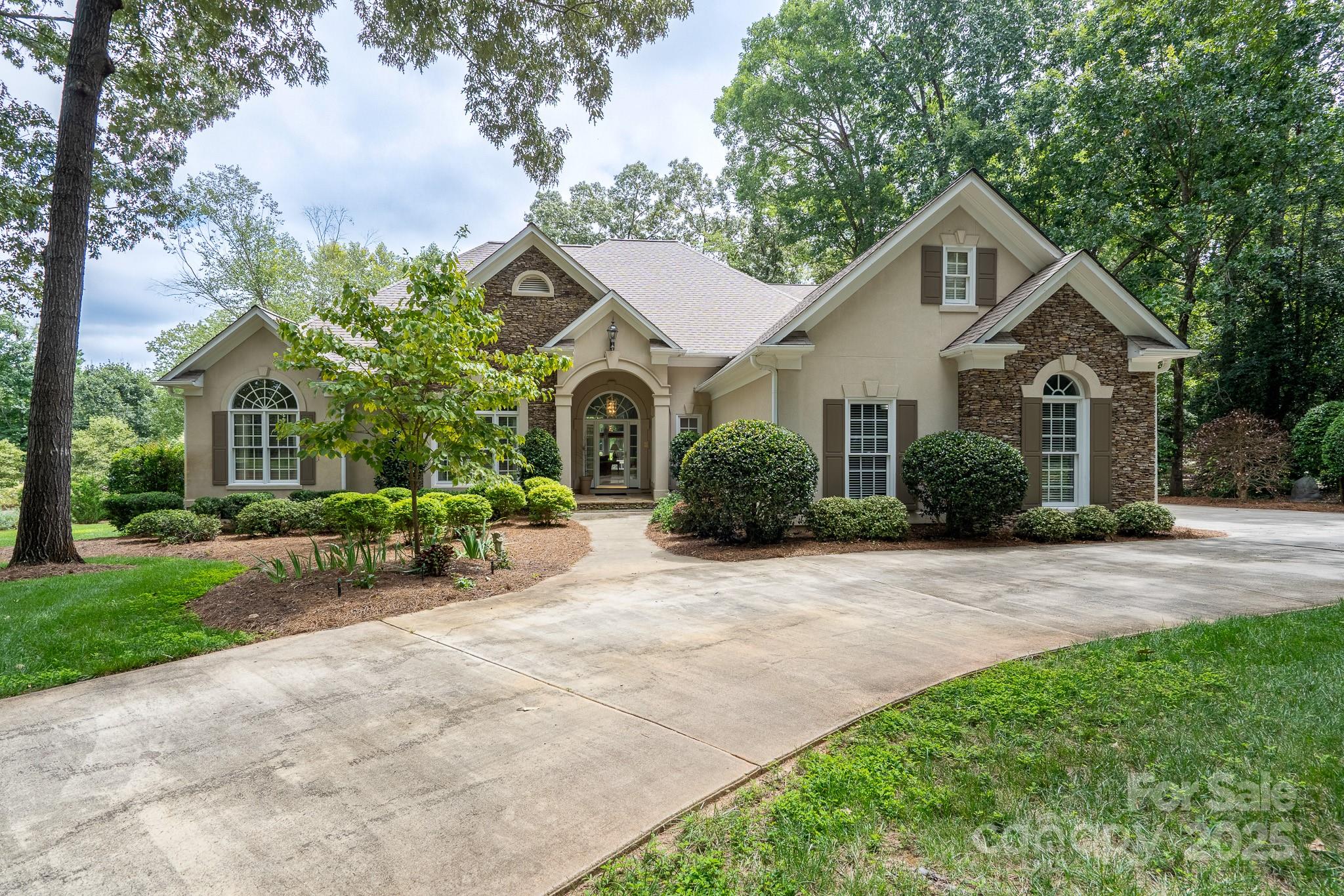 This one-of-a-kind property showcases views of the Old North State Club championship golf course and is the perfect blend of comfort and elegance. Bright and airy, open floorplan that flows seamlessly from one space to the next. The kitchen is open to the two-story Great Room, which serves as the heart of the home. The breakfast nook is conveniently located off the kitchen and leads directly to the back porch. Escape to the spacious master suite, your own private retreat. Outside, you'll find an incredible oasis perfect for year-round enjoyment. The property boasts a screened-in porch as well as an additional porch for open-air relaxation. A standout feature of the backyard is the serene water feature, creating a tranquil atmosphere you'll love. Don't miss the opportunity to own this beautiful home within the Old North State Club community, where every detail has been thoughtfully considered. Schedule your private showing today!